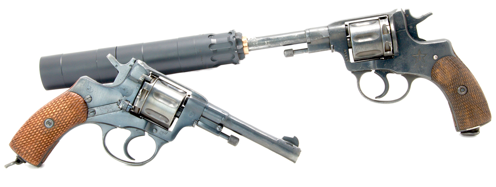 nagant m1898 revolvers two guns opposing position rear revovler has suppressor silencer affixed to barrel wood grips vintage weather finish white background