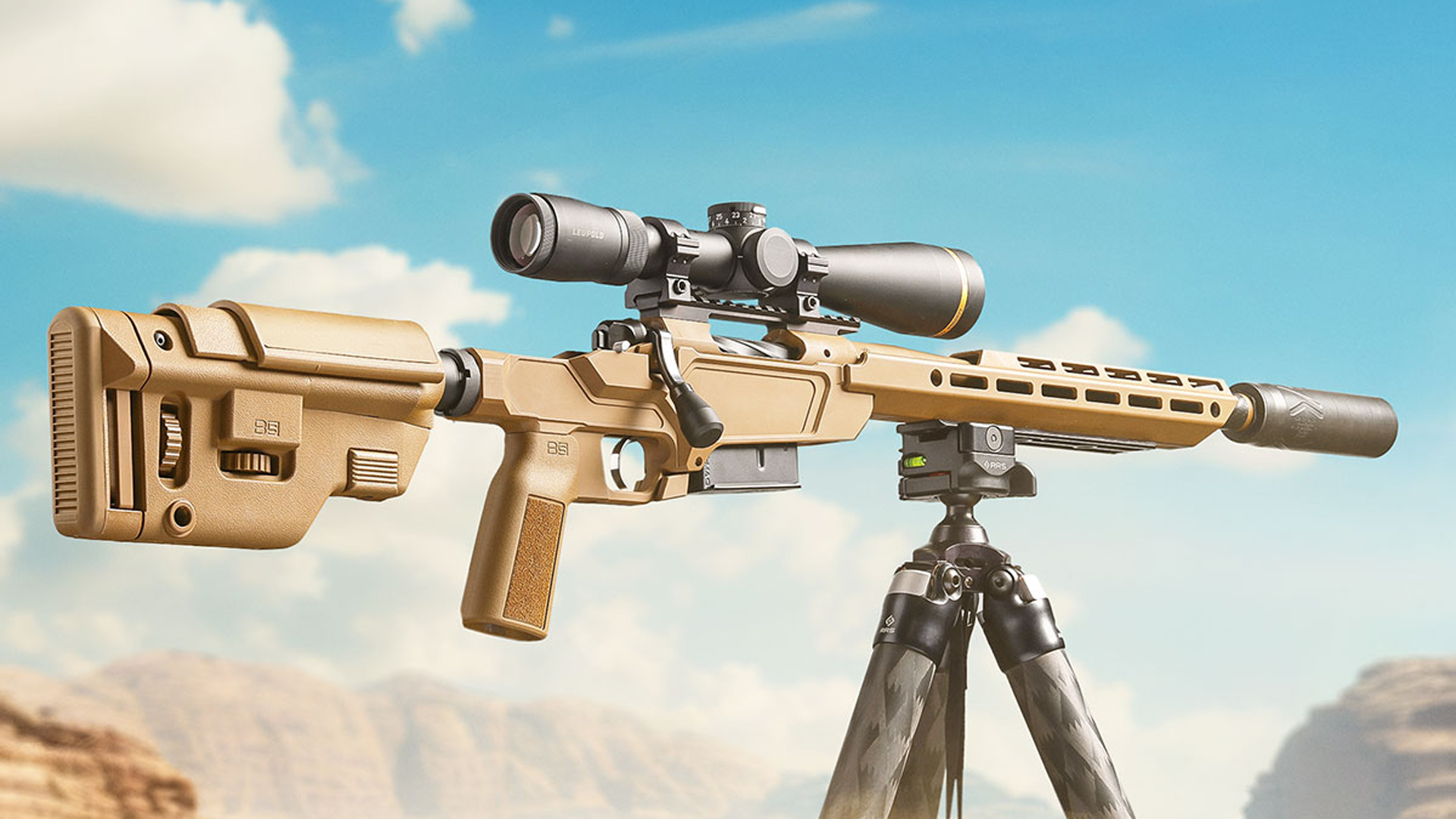 Springfield Armory Model 2020 Heatseeker bolt-action rifle Coyote Brown color fixed on tripod outdoors with a Leupold riflescope attached.