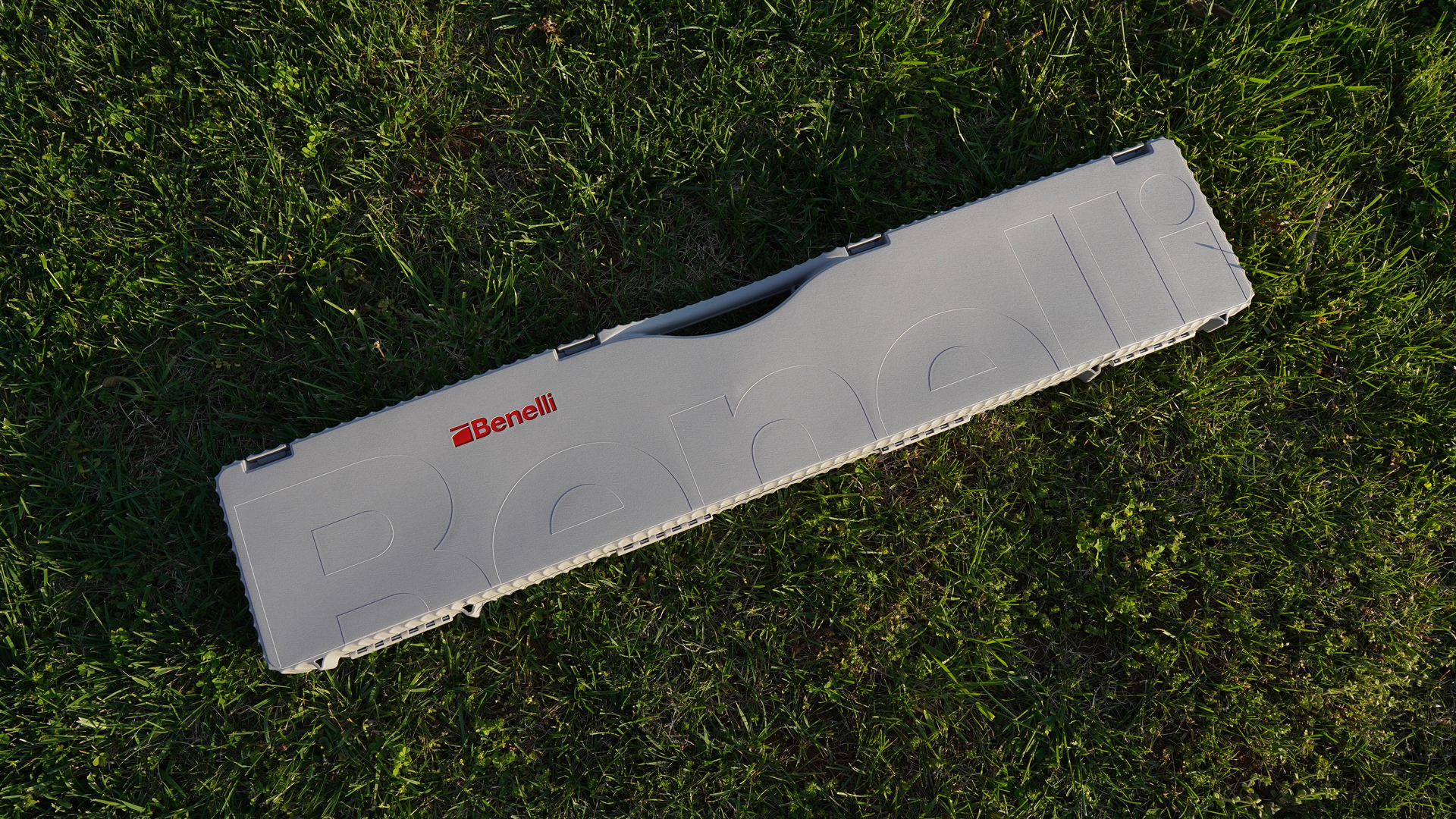 Benelli ETHOS Cordoba BE.S.T. gun case gray plastic laying in green grass