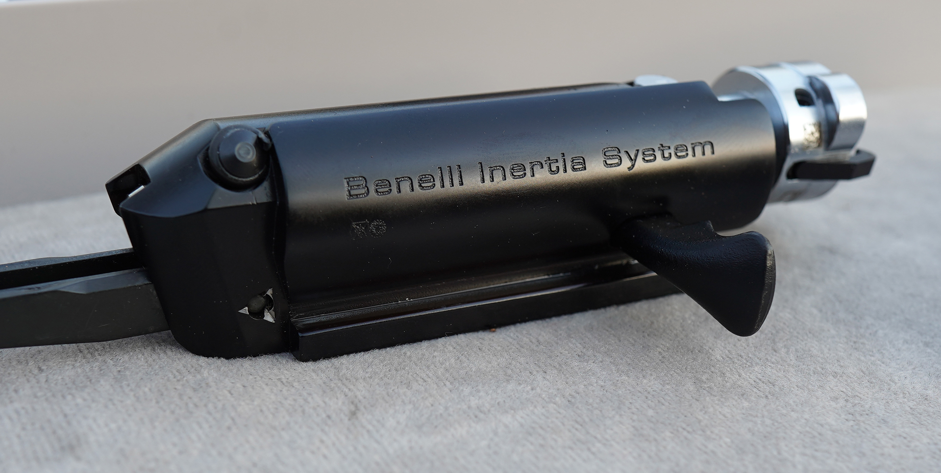 Benelli Inertia System bolt assembly black metal silver bolt head