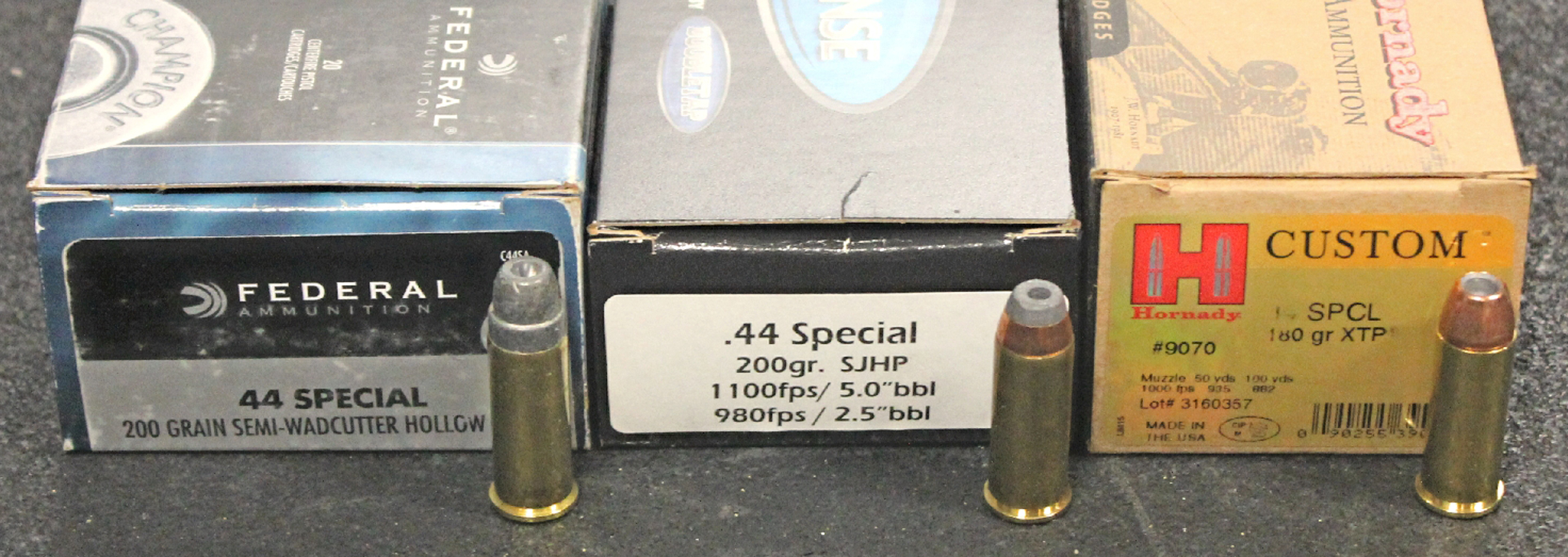 three ammunition boxes of .44 Special federal double tap hornady