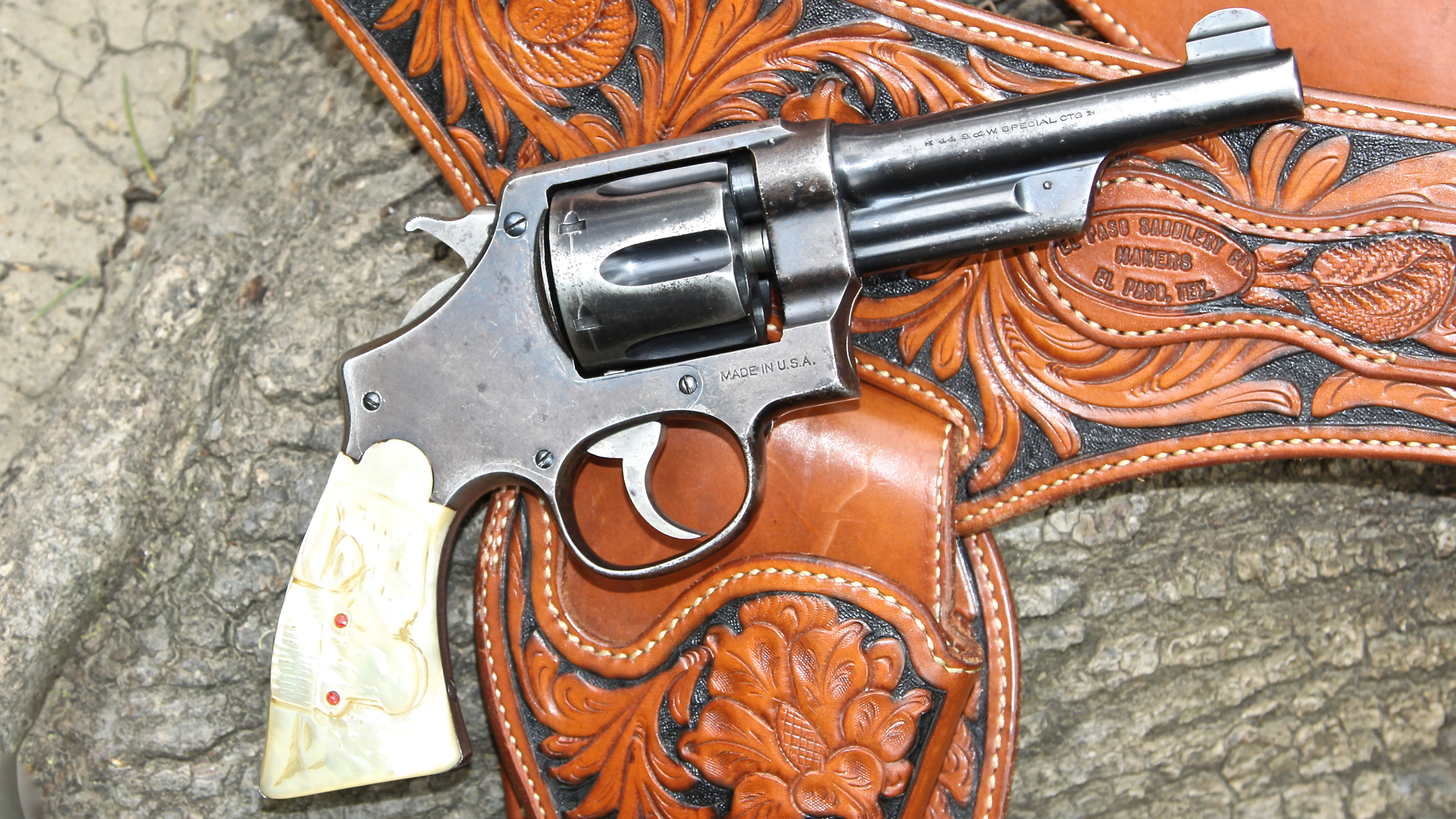 The final entrant in the S&W Hand Ejector trilogy was the .44 Hand Ejector Model of 1926. Thanks to pressure from Smith & Wesson distributor Wolf & Klar, it brought back the under-barrel shroud. This particular gun was shipped to Wolf & Klar on June 29, 1928; the buyer paid extra for the carved steer head pearl grips.