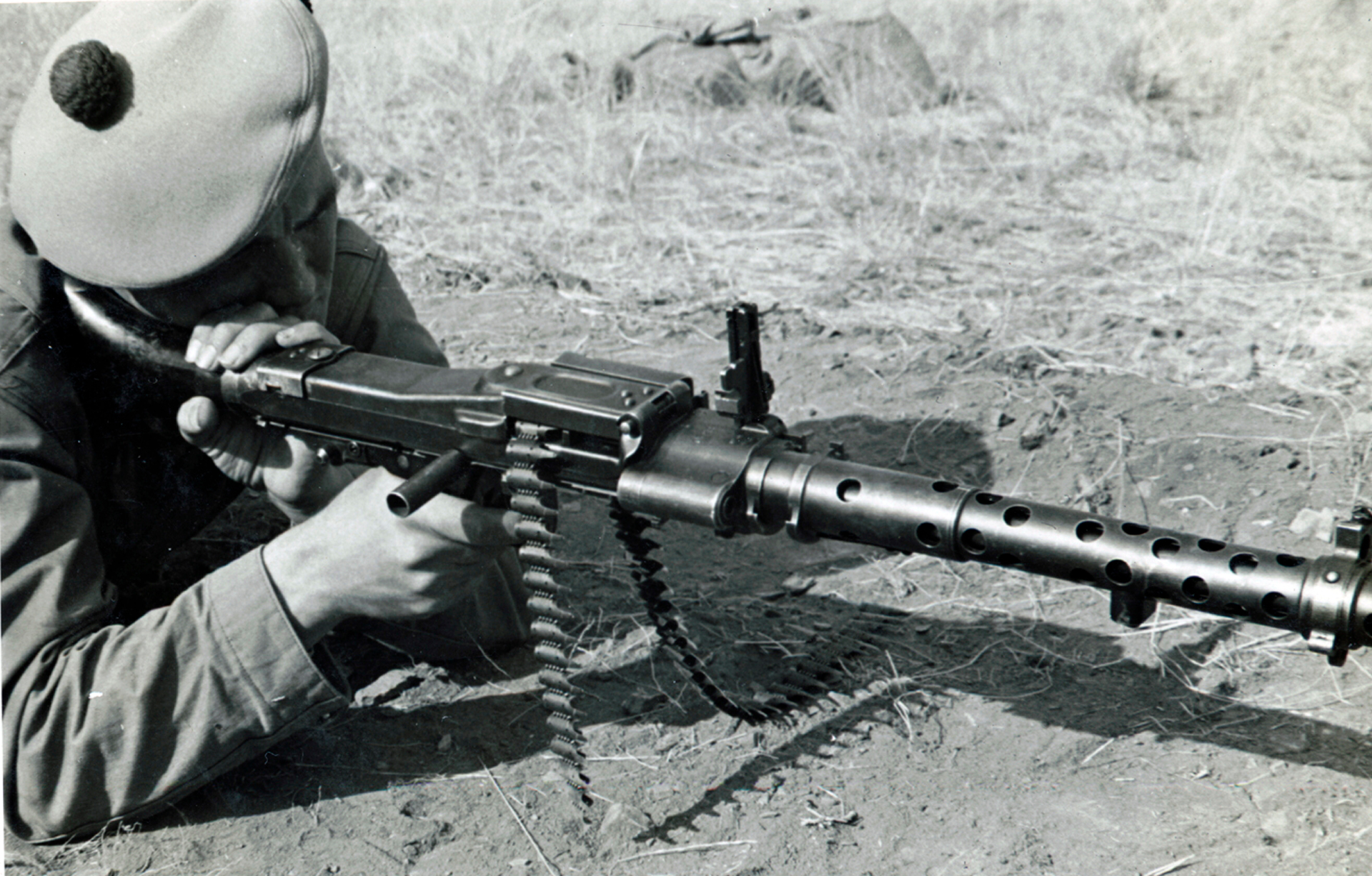 4)	The Canadians provided combat experience including first-hand knowledge of German small arms. Here a Canadian member of the FSSF demonstrates the German MG34.  Author’s collection
