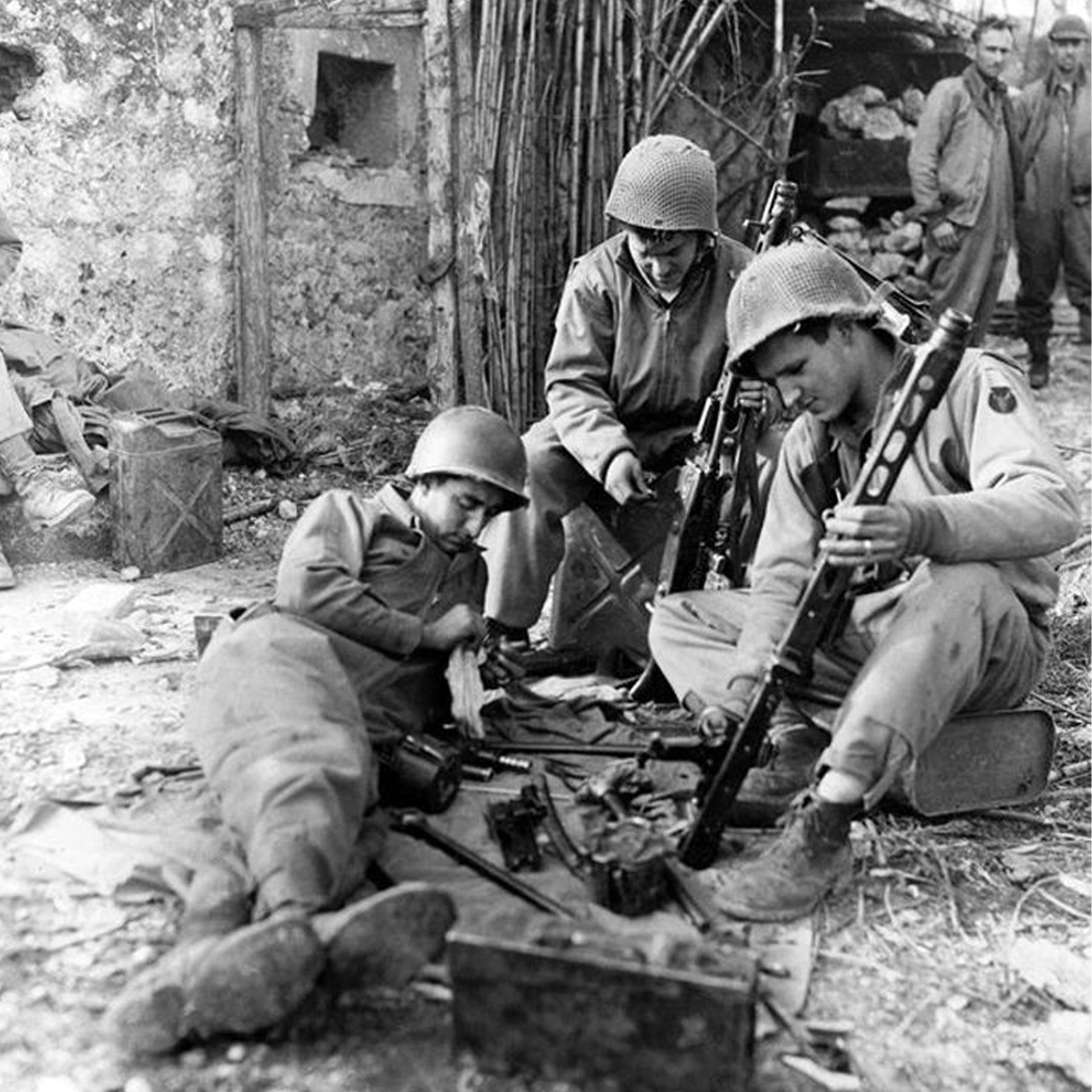 Men of the 34th Infantry Division examine a captured MG42. Italy, 1943. Photo courtesy of National Archives and Records Administration, NARA.