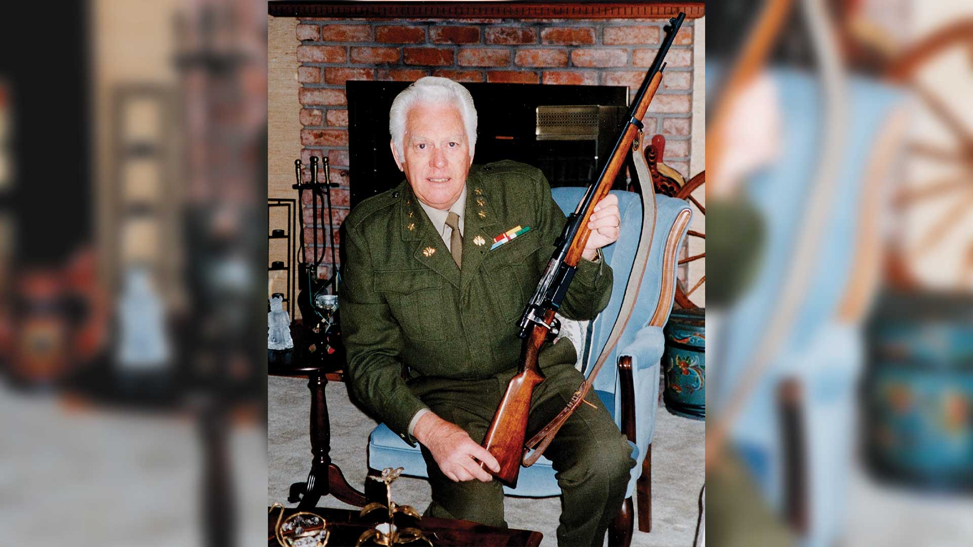 Man soldier uniform indoors house kneeling bolt-action rifle