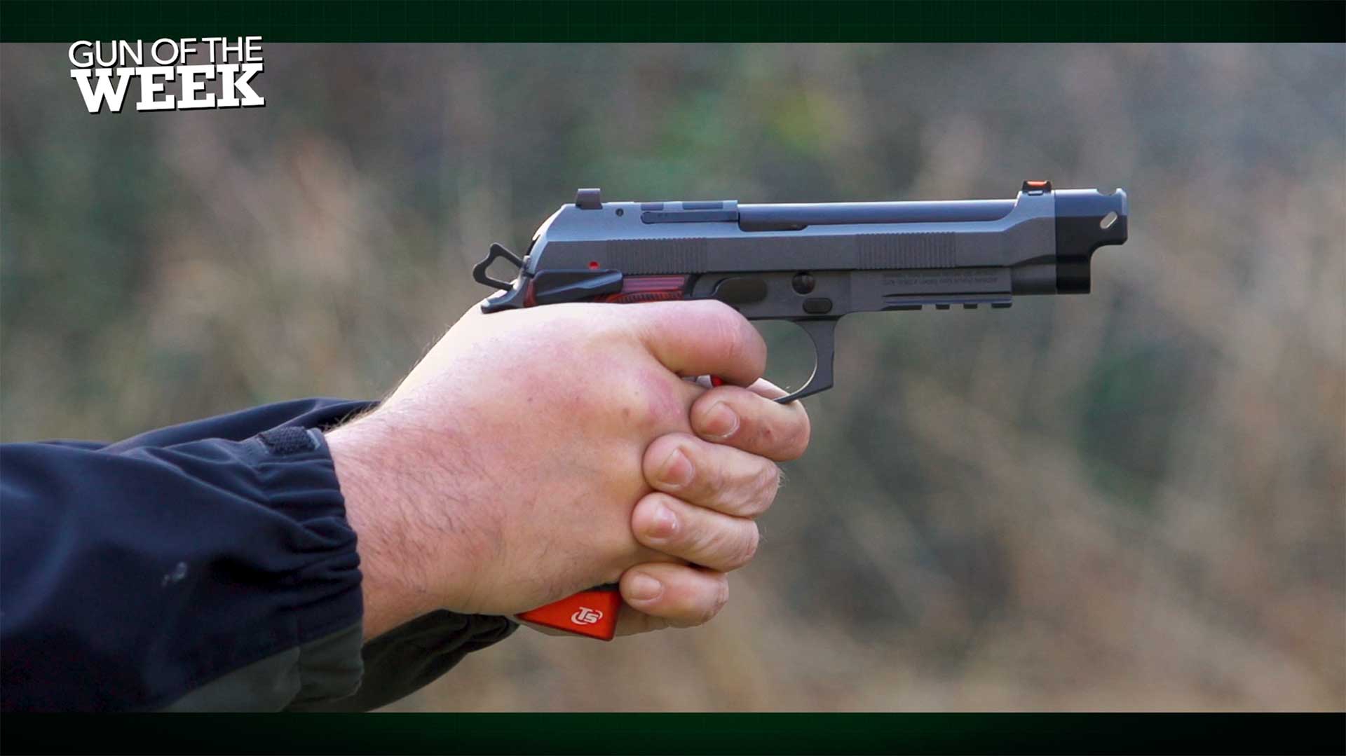 Man shooting the Beretta 92XI Gara on an outdoor range.