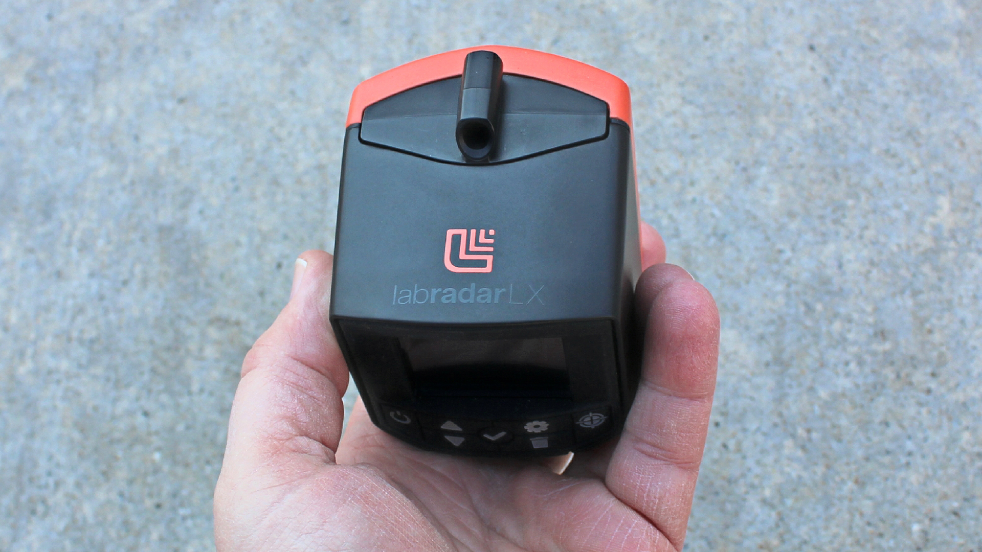 Labradar LX chronograph device held in hand