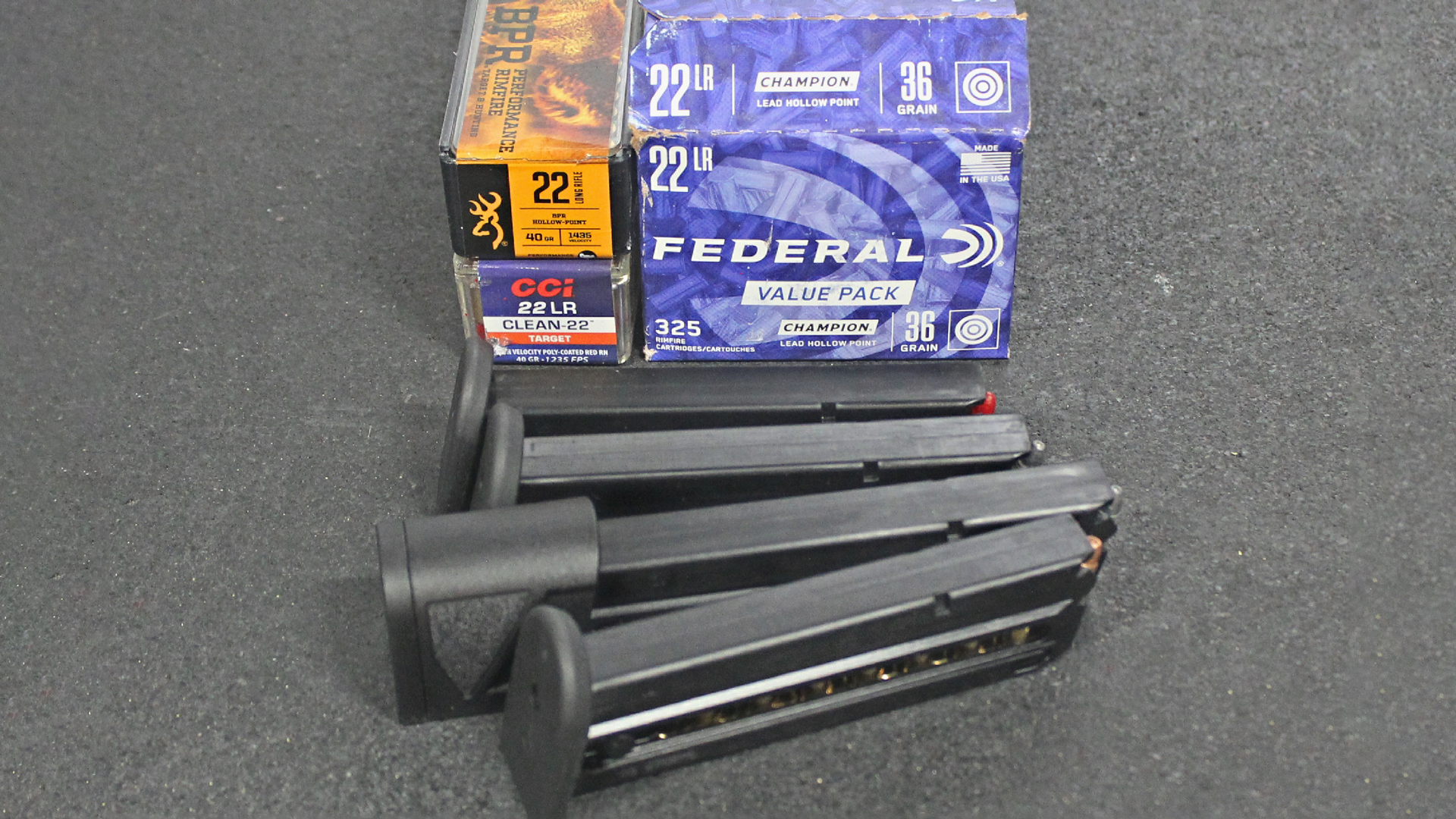 Ammunition boxes with four black Taurus TX22 pistol magazines 22LR