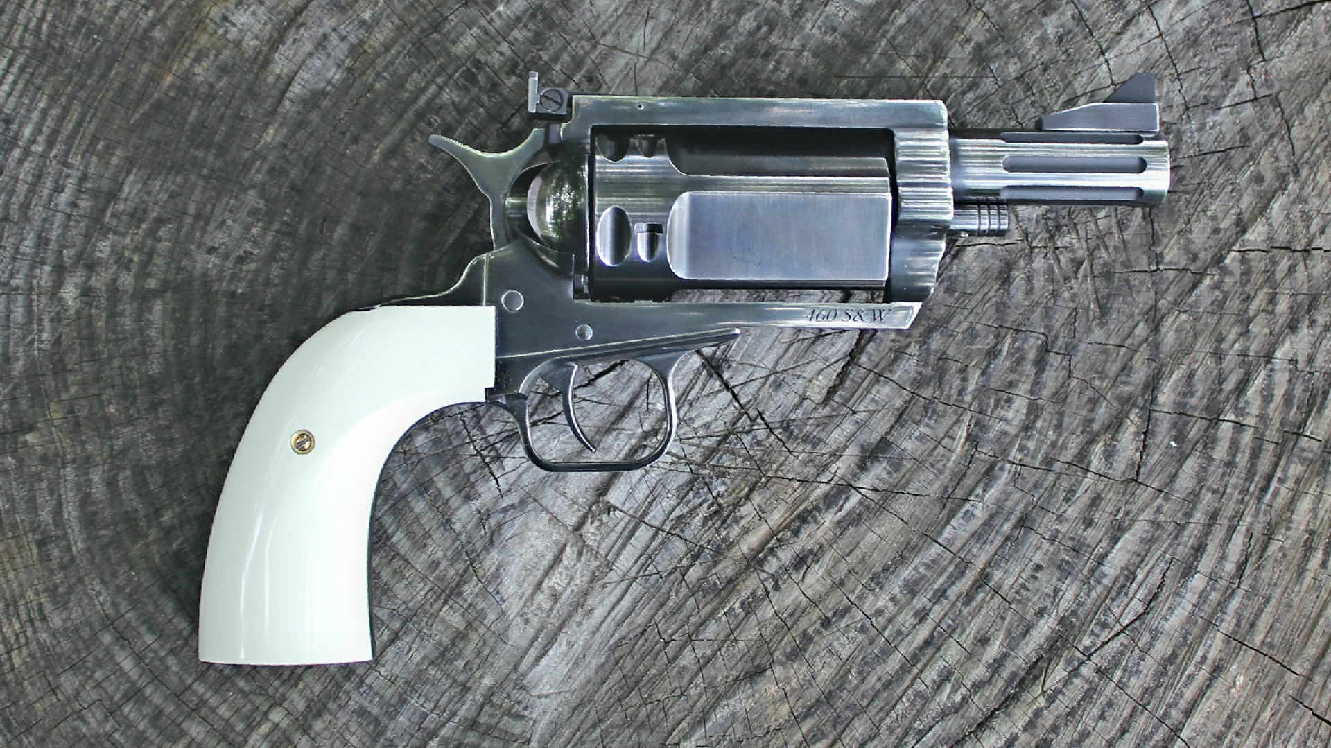 Magnum Research BFR Thunder Buggy revolver right-side view shown with white ivory stocks on log