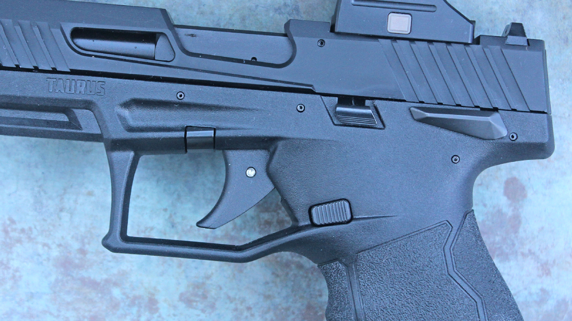 Taurus TX22 black pistol, left view of the controls