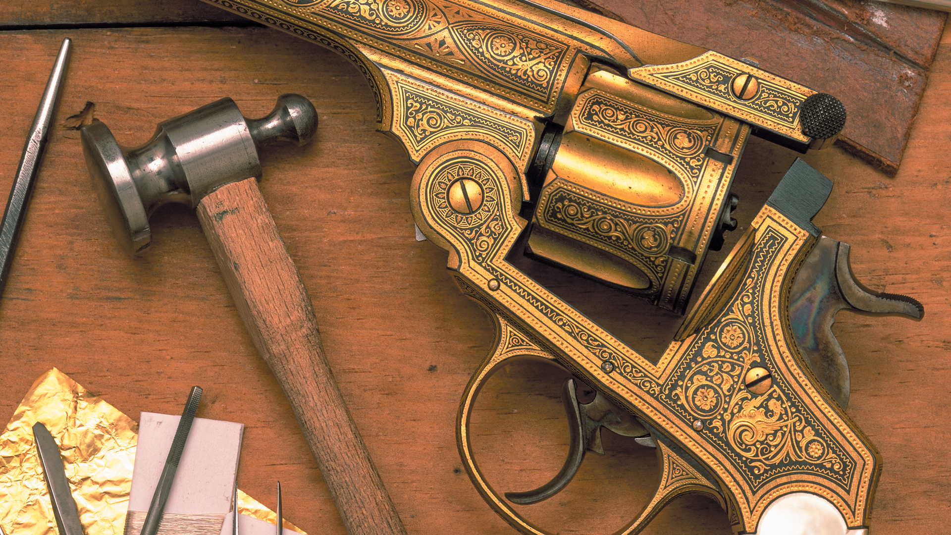 Gold Damascening on open revolver engraving gold plating hammer tools workbench