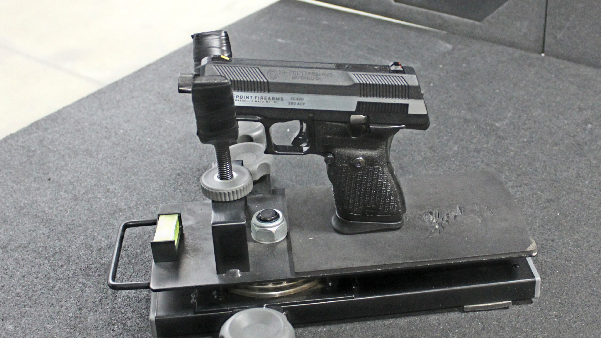 Hi-Point Firearms YC380 pistol in cradle rest indoor shooting bench