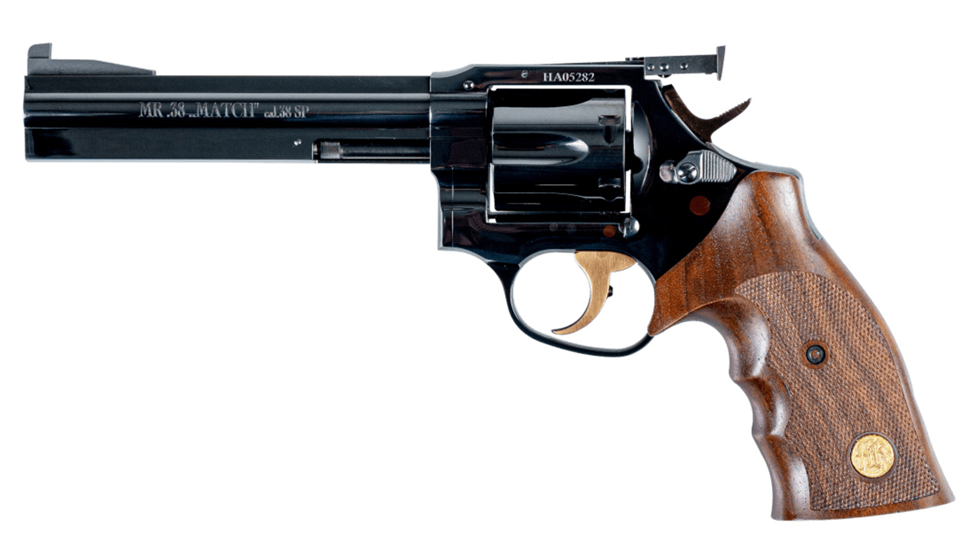 MR73 revolver left-side view on white wood stock panels with finger grooves and medalion