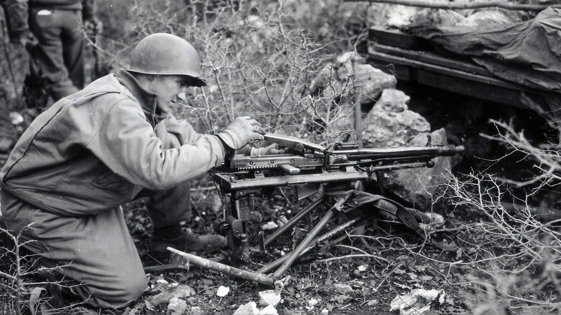 A prized war trophy: A GI examines a Lafette tripod-mounted MG42 in France during the autumn of 1944. Photo courtesy of National Archives and Records Administration, NARA.