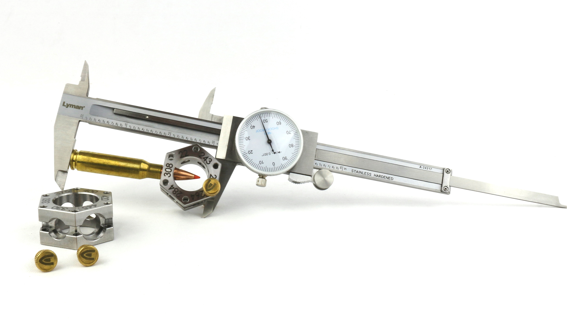 Creedmoor Sports Multi-Caliber bullet comparator shown with dial caliper ammunition on white background