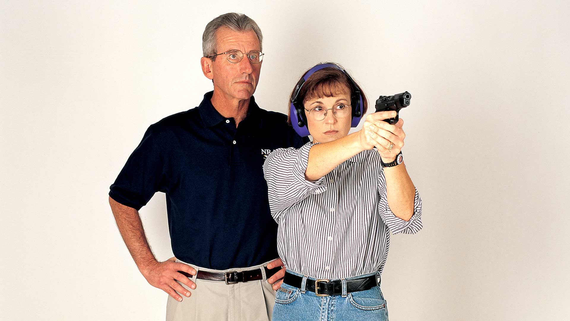 Man woman training weaver handgun stance