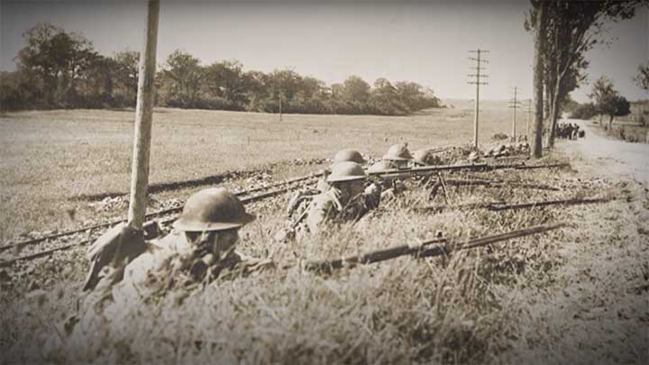 American Soldiers take cover behind a road armed with Springfield M1903 rifle and a M1915 Chauchat light machine gun.