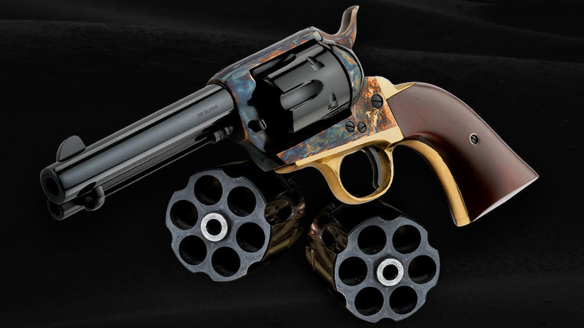 Davidson's Pietta 1873 revolver shown its its two additional cylinders.