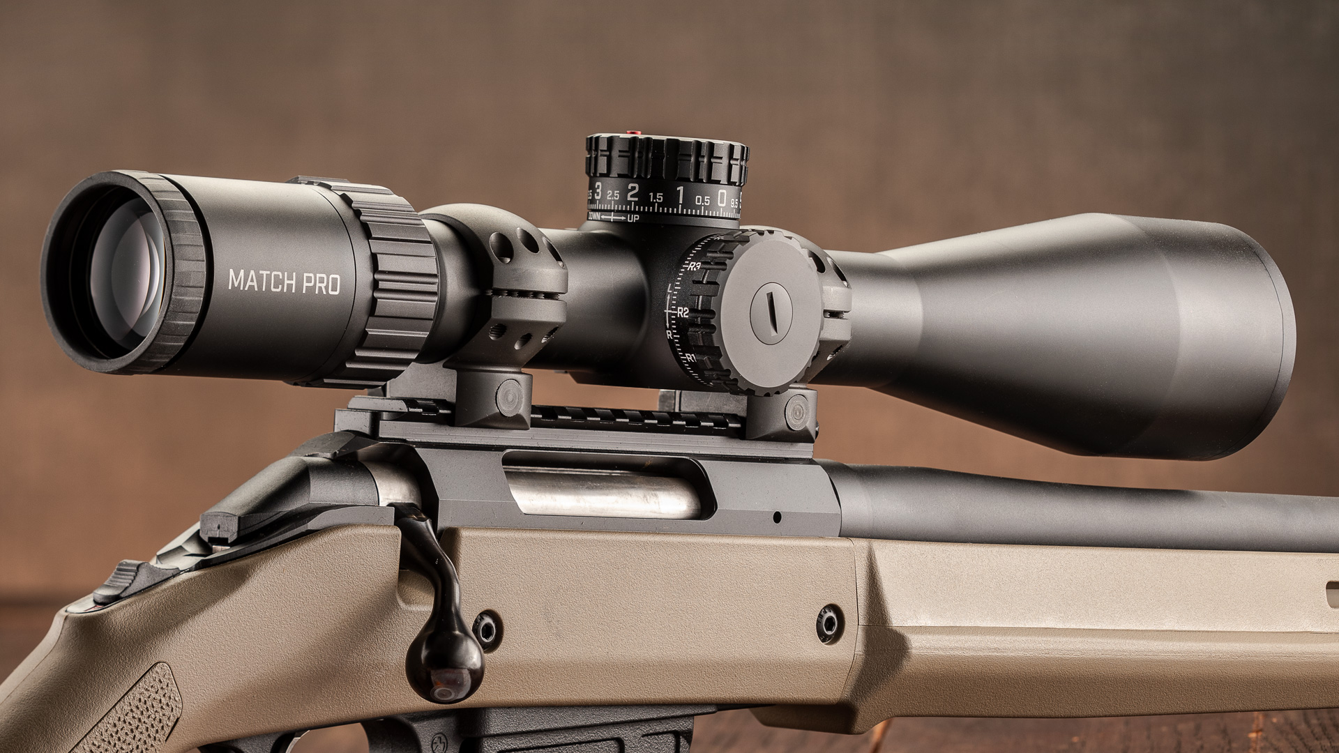 Bushnell Match Pro ED 5-30X 56 mm riflescope attached to ruger bolt-action rifle flat dark earth stock