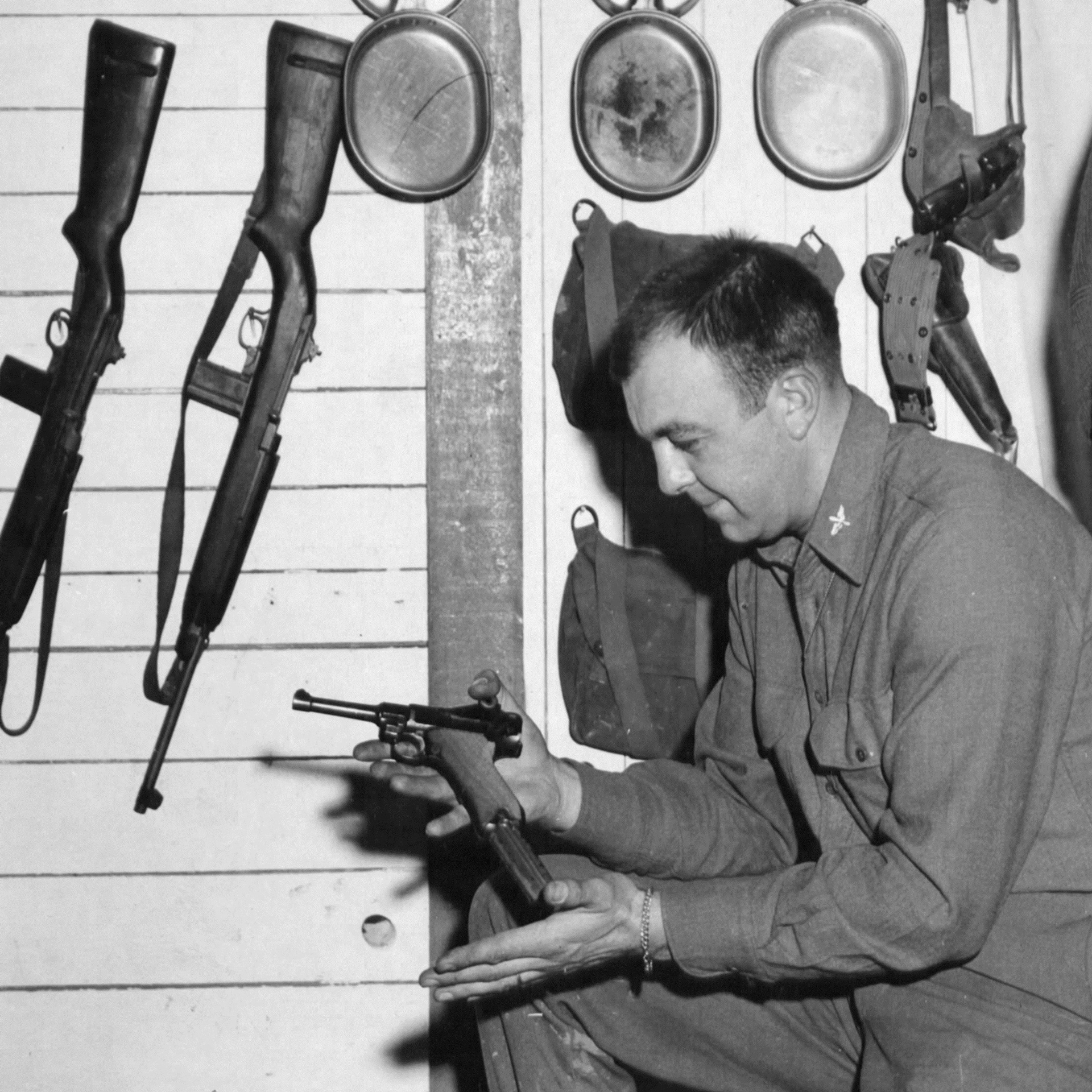 A 9th Air Force officer shows off a P08 Luger pistol—possibly the most popular war trophy of the war.