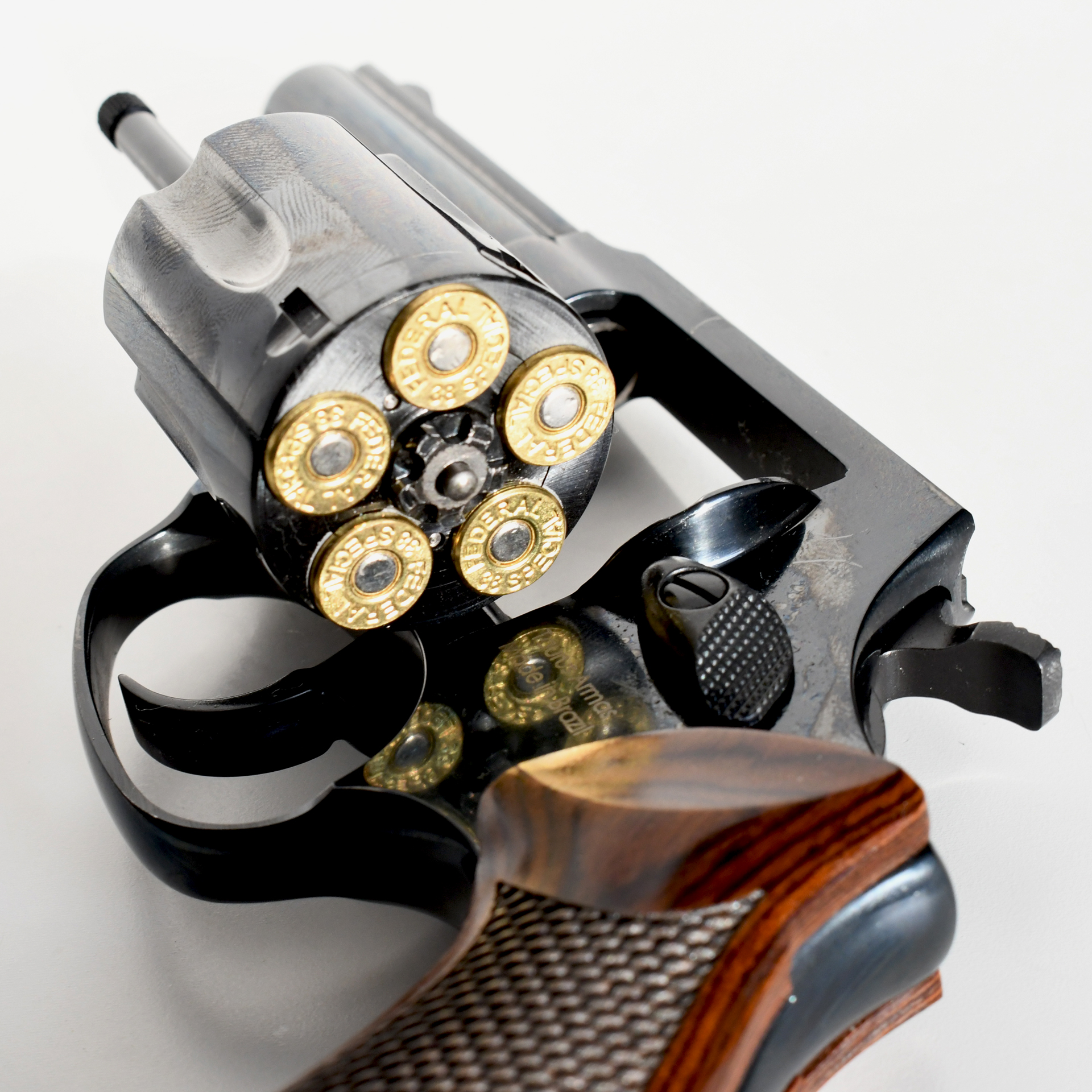 Heritage Manufacturing Roscoe double-action revolver shown on its right side with cylinder open fully loaded with five cartridges brass bullets