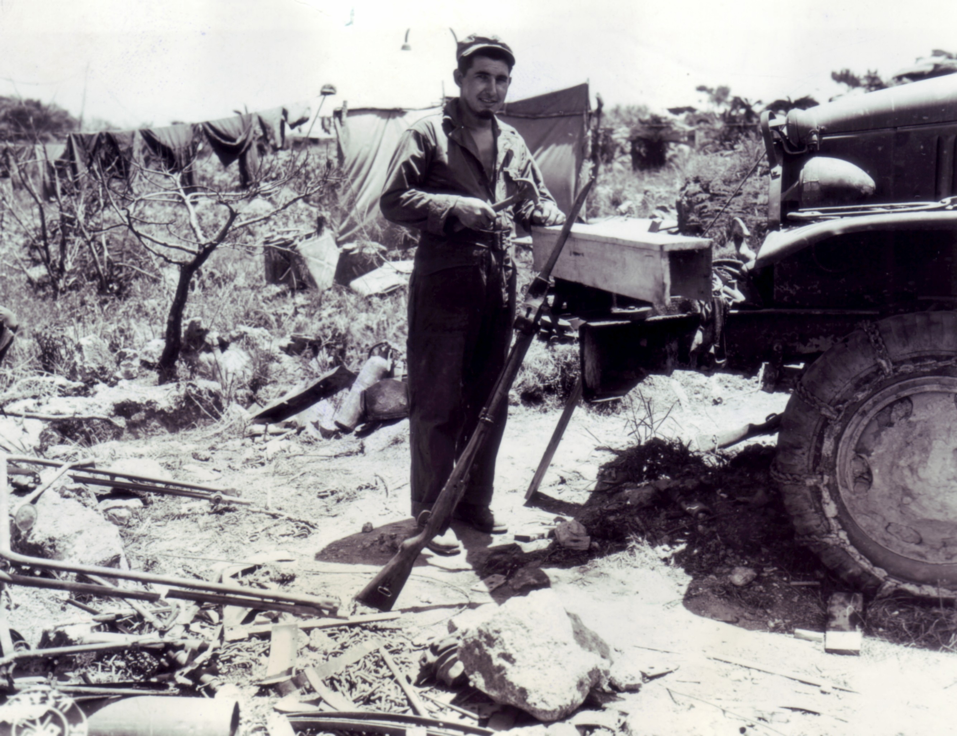 Making a “send-home” box on Okinawa, with an Arisaka rifle standing by to travel to the USA.