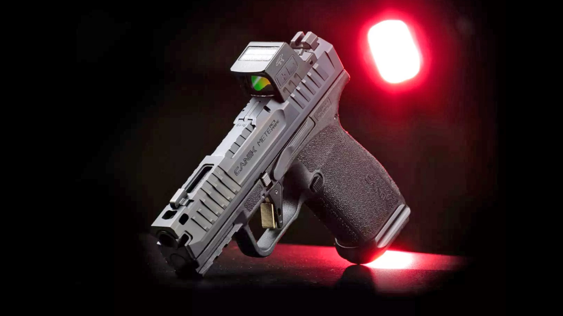 Top view of the Canik Mete MC9 Prime with a mounted red-dot optic.