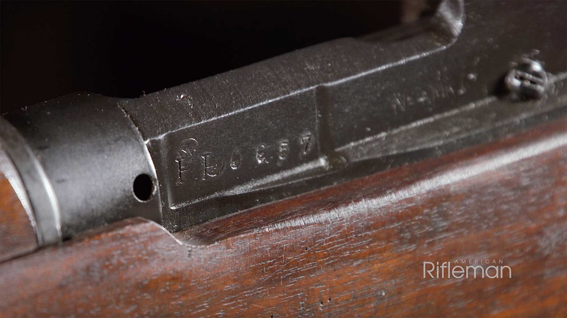 PP serial number marking on the left side of this British No. 4 Lee-Enfield rifle.