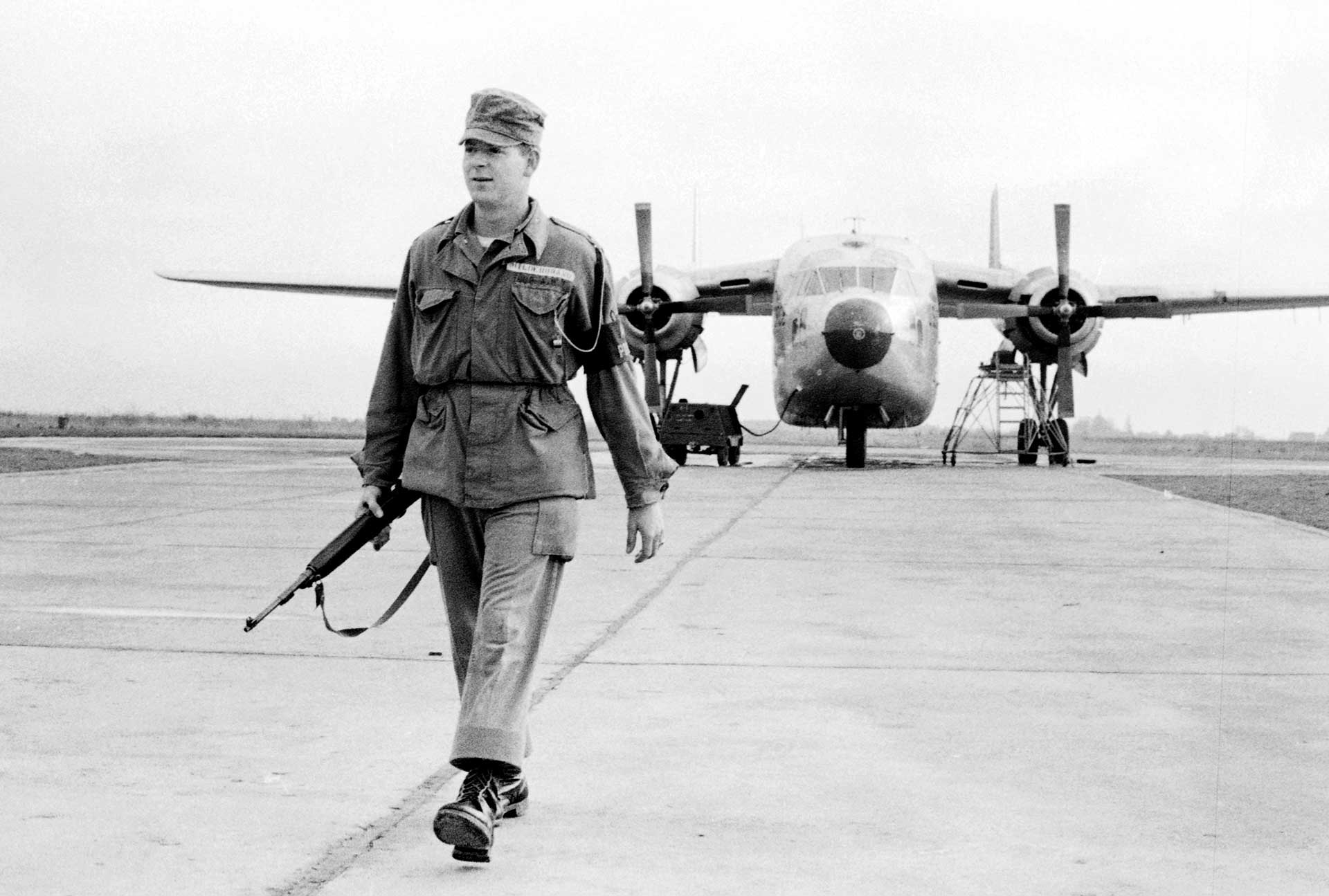 A U.S. airman provides security at a base with the M1 carbine.