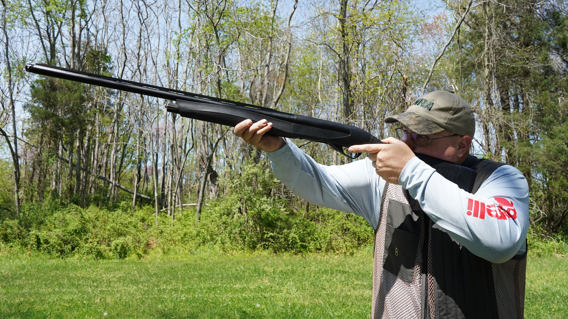 Man standing outdoors holding Benelli ETHOS Cordoba BE.S.T. shotgun