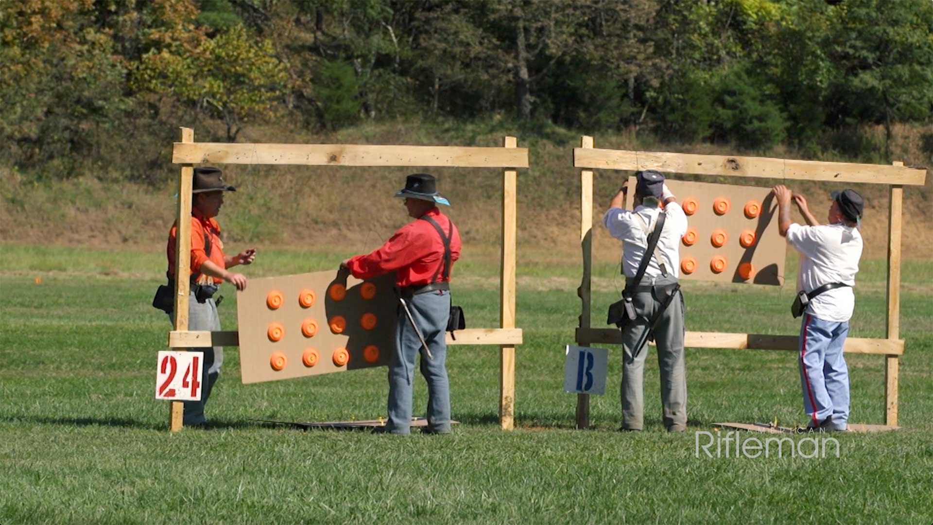 Four men hanging targets as part of the N-SSA's smoothbore musket match.