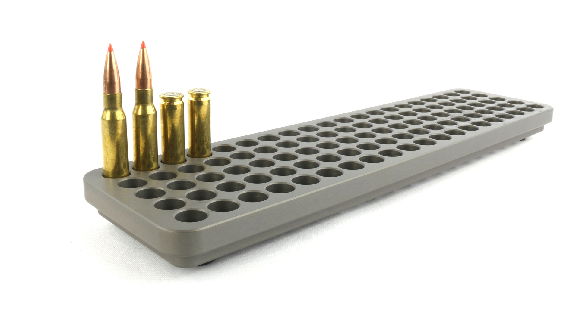 782 gunworks "hundo" loading block with brass cartridges inserted white background