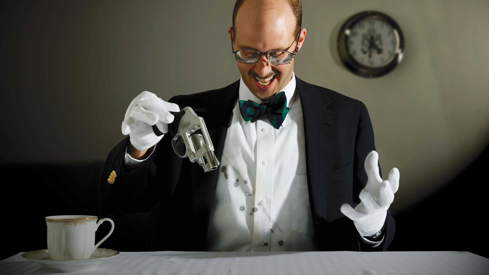 man suite black white gloves silver revovler clock tea cup table