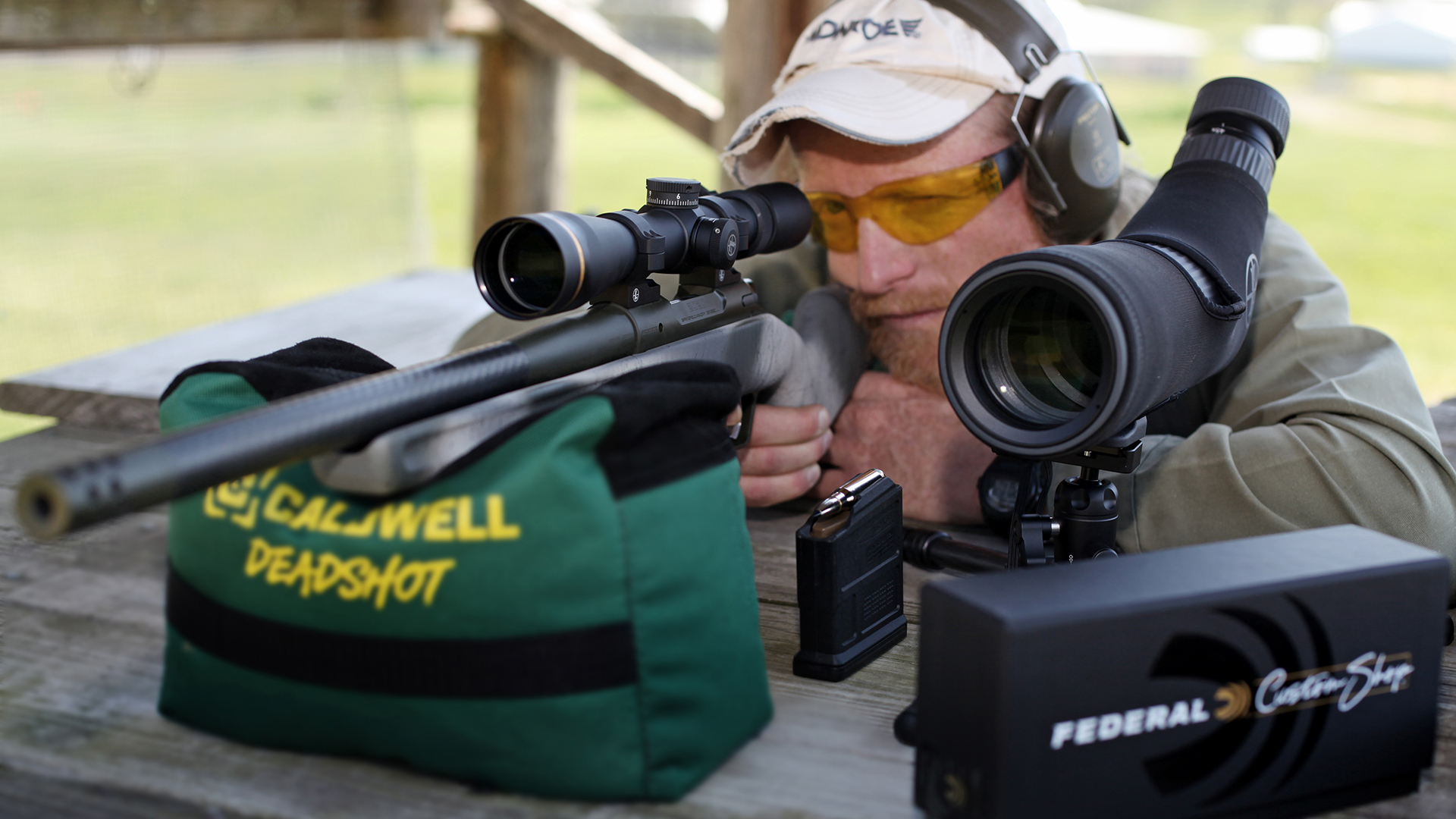 Author Knupp shooting bolt-action Springfield Armory hunting rifle off caldwell deadshot shooting bag leupold rangefinder fedearl custom shop ammunition outdoors wood table