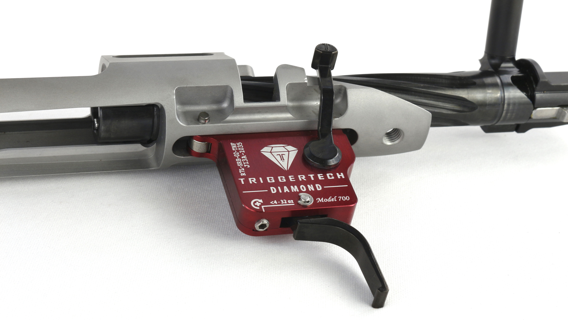 TriggerTech Diamond trigger pack installed on stainless steel rifle recevier