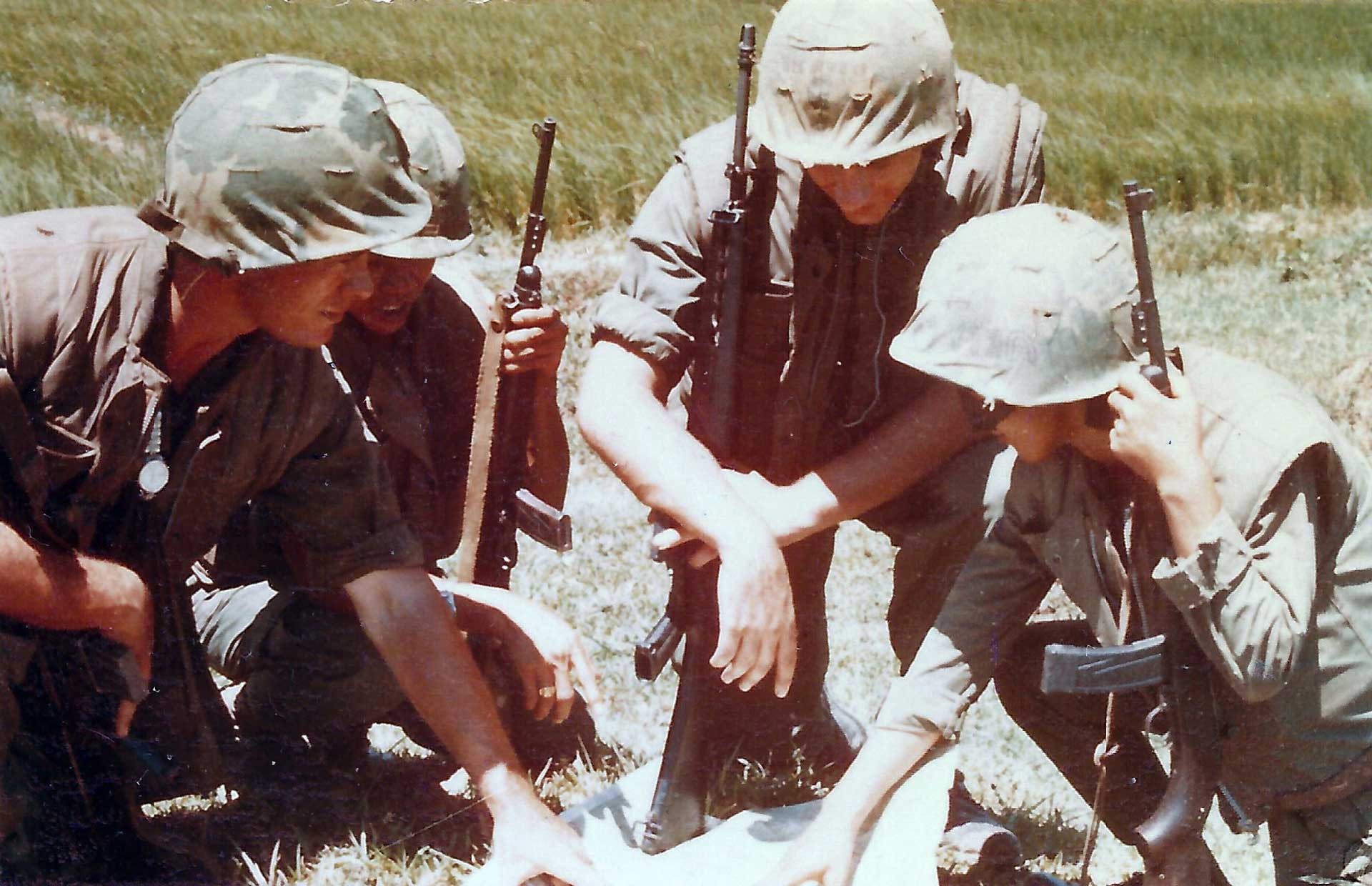 A squad of U.S. soldiers armed with the M16 and M2 carbine in Vietnam.