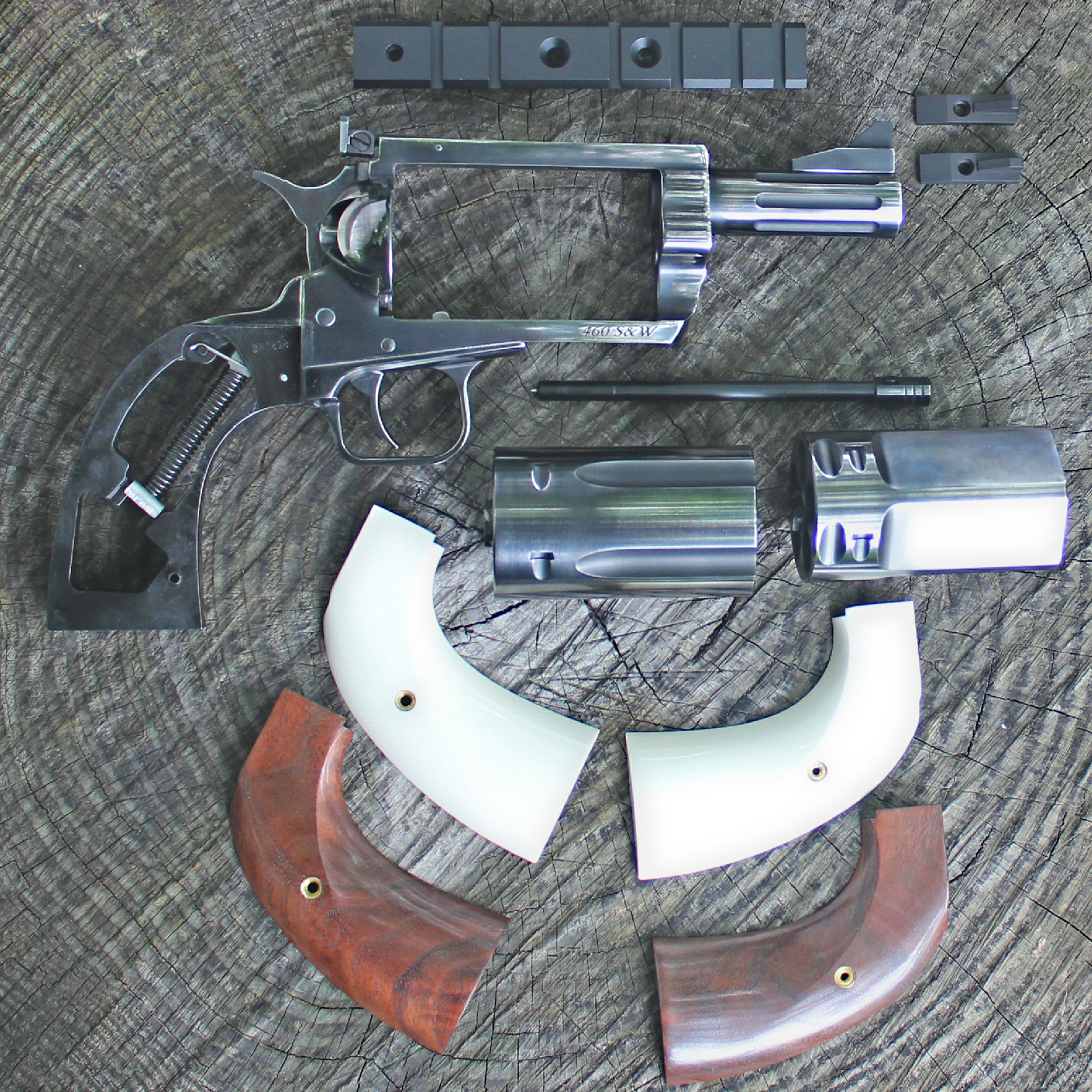 Magnum Research Thunder Buggy BFR disassembled parts gun revolver arrangement on log with ivory stocks walnut metal