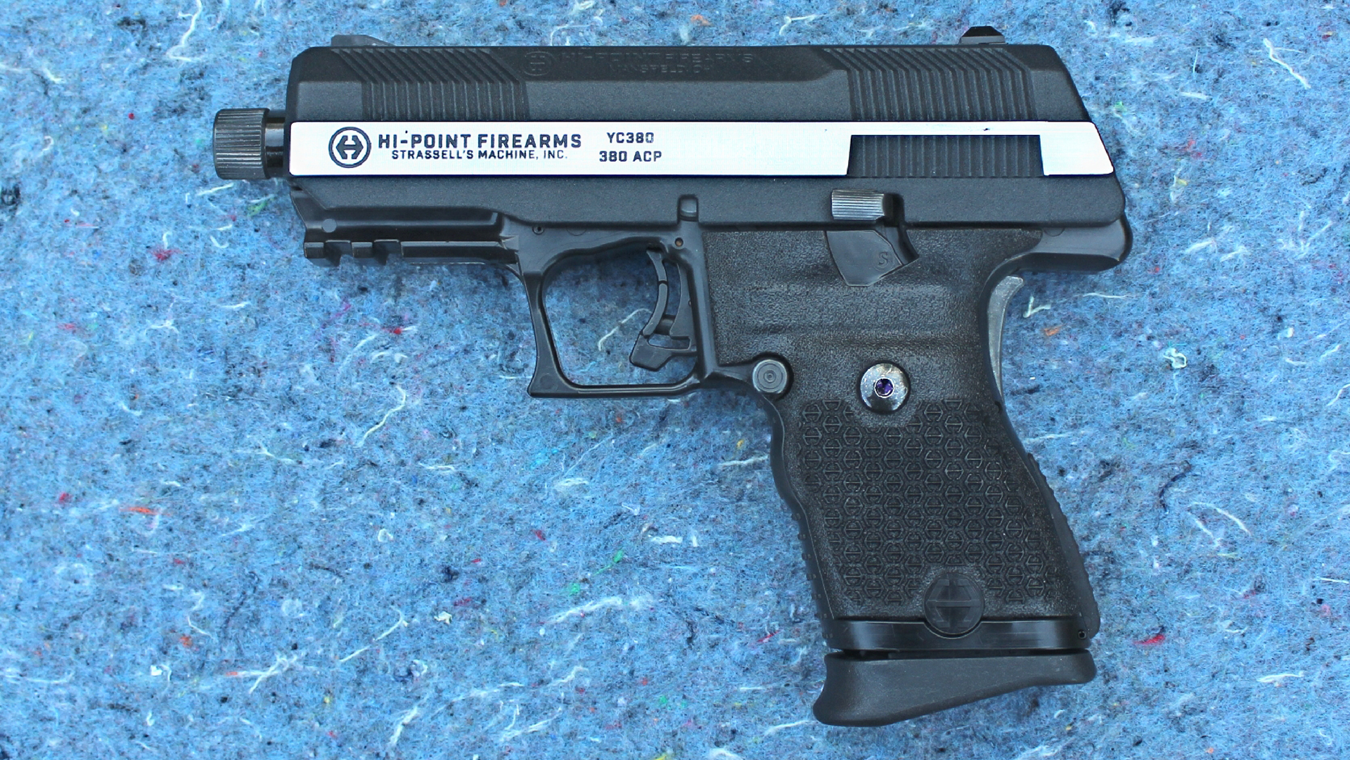 Hi-Point Firearms YC380 yeet cannon pistol left-side view on blue speckled background two-tone metal slide black frame