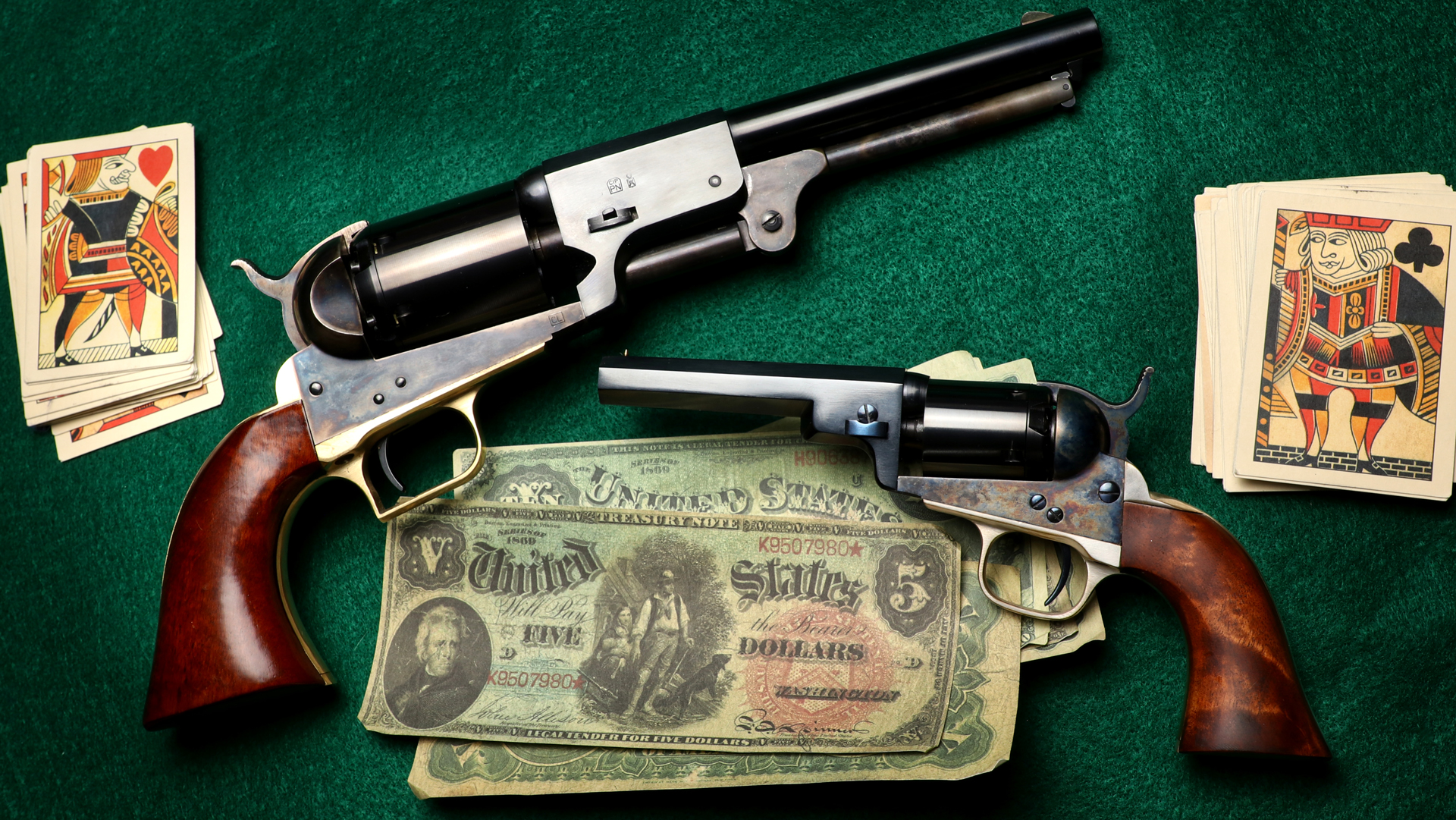 Cimarron Dragoon conversion revolvers shown with money and poker cards