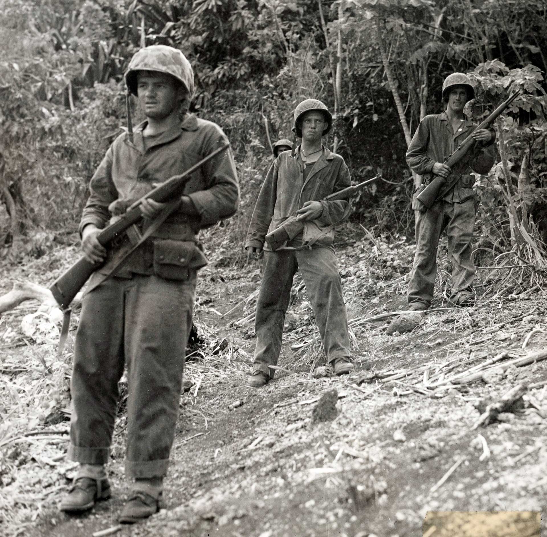 U.S. marines on patrol with the M1 carbine in the jungles of Saipan.