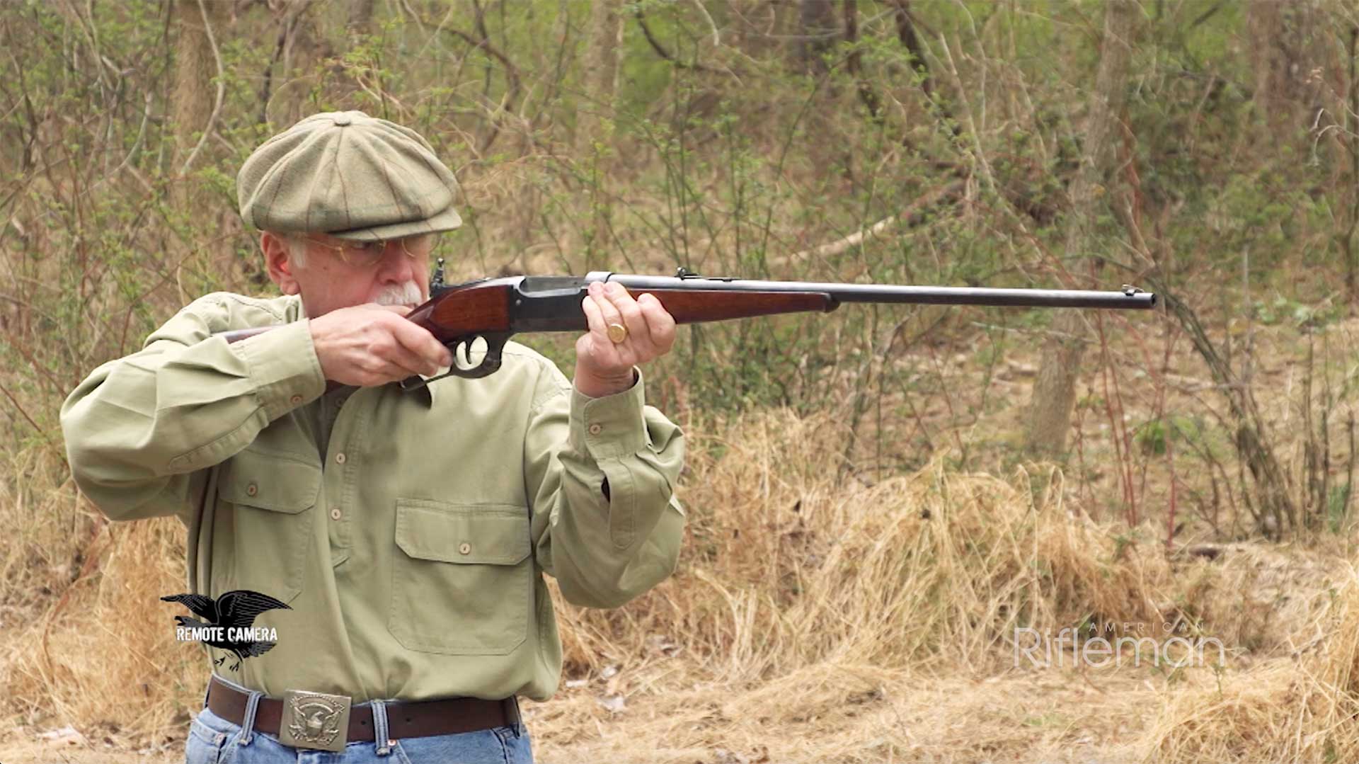 Man shooting Savage Model 99 in the woods.