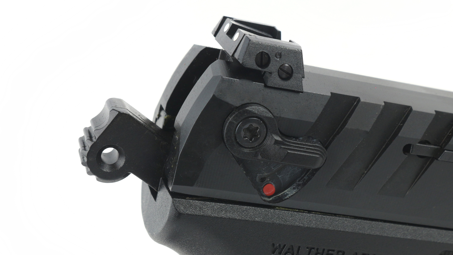 Walther PD380 gun pistol closeup rear view of hammer spur and safety lever rear sight