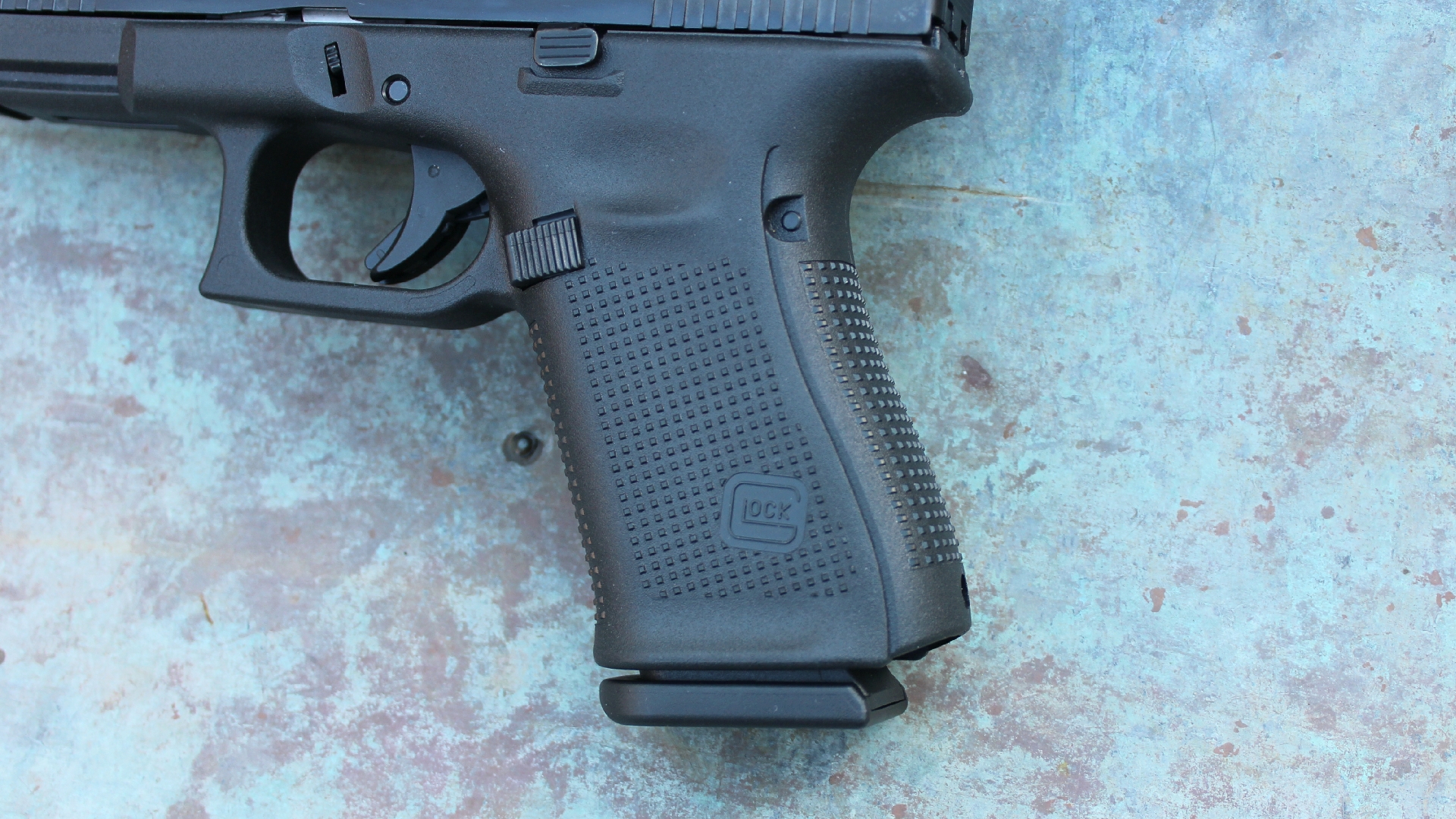 Glock G49 Gen5 MOS grip shown with magazine inserted illustrating texturing