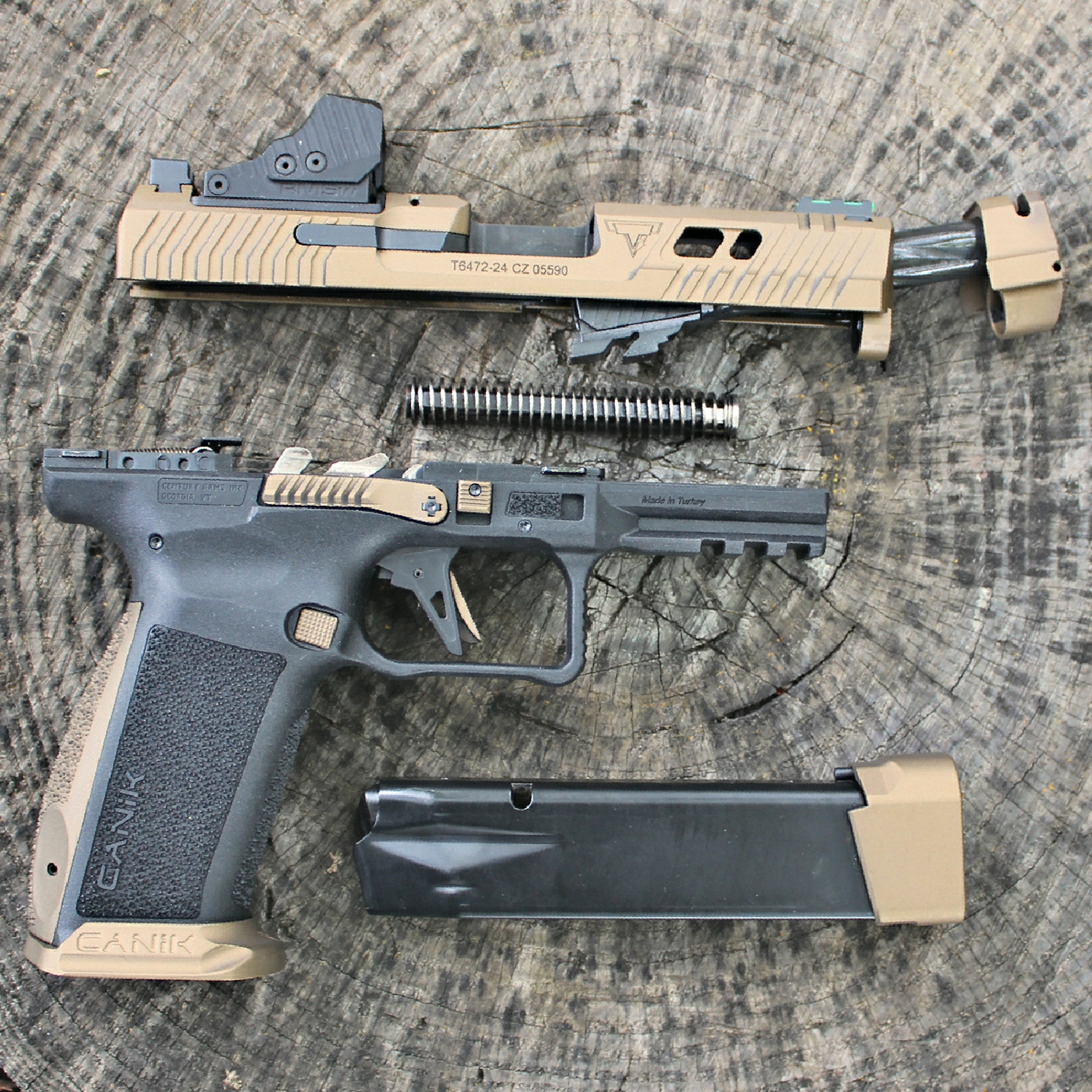 Century Arms Canik TTI Combat 9 mm pistol right-side view parts slide frame magazine spring resting on log