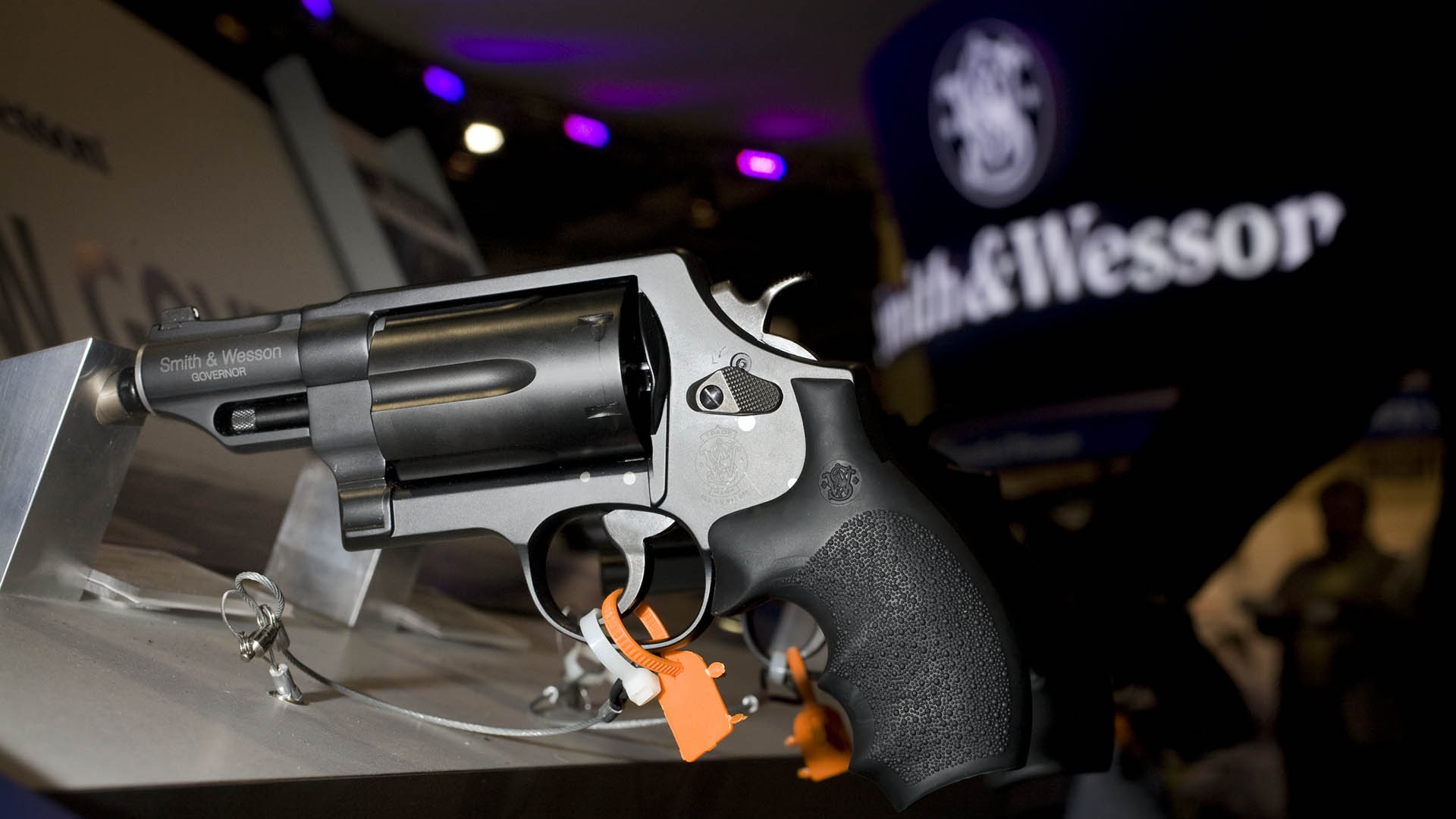 left-side view smith & wesson black revolver rack display show dark ominous