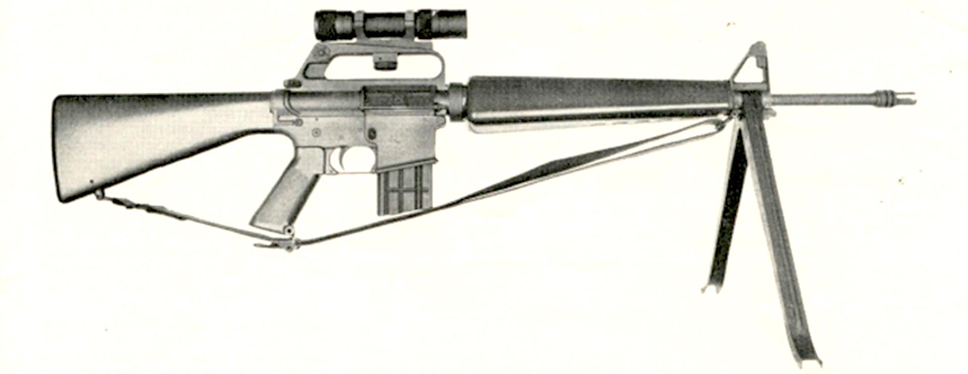 The first ArmaLite AR-15 right-side view shown with sling bipod optic on white background