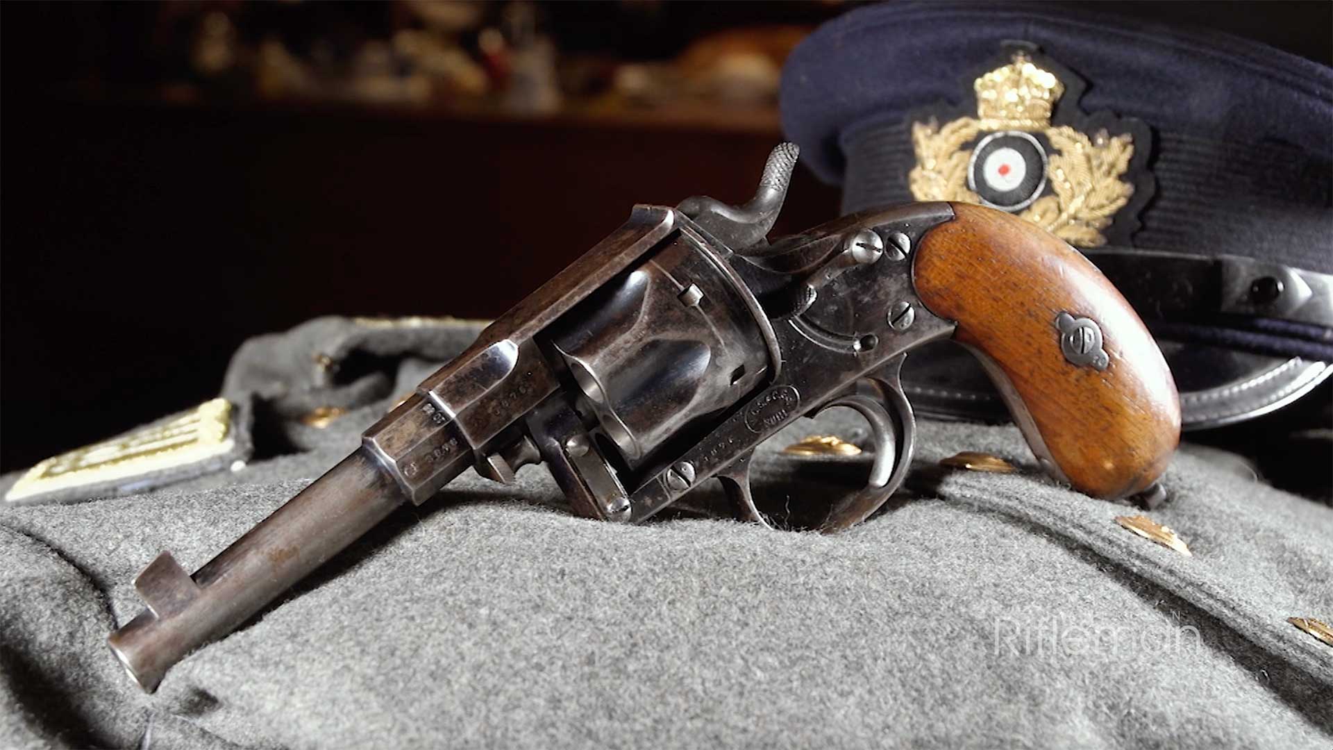 Left side of the German Commission Revolver resting on a gray coat.