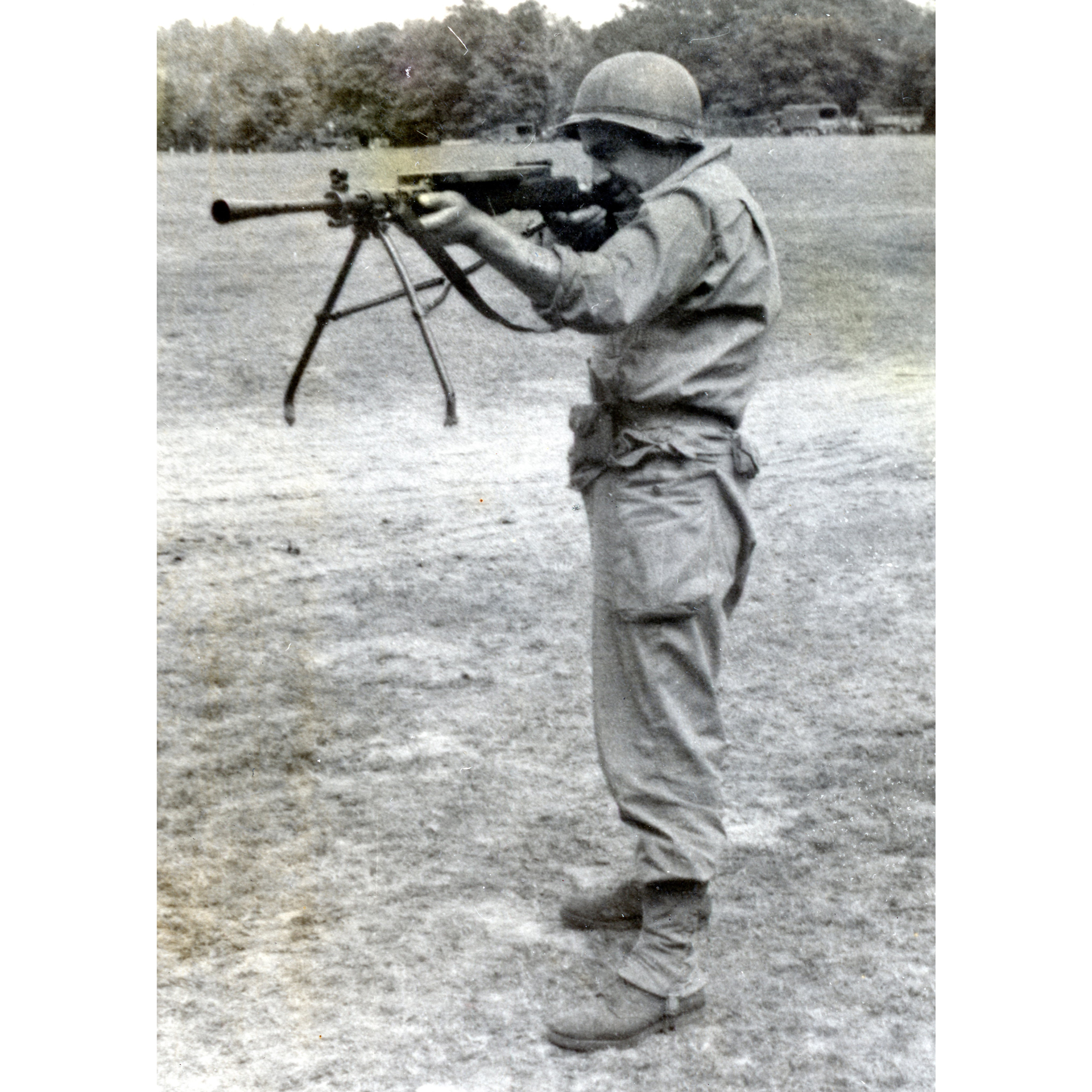 U.S. Army soldier standing holding shooting soviet dp-27 light machine gun