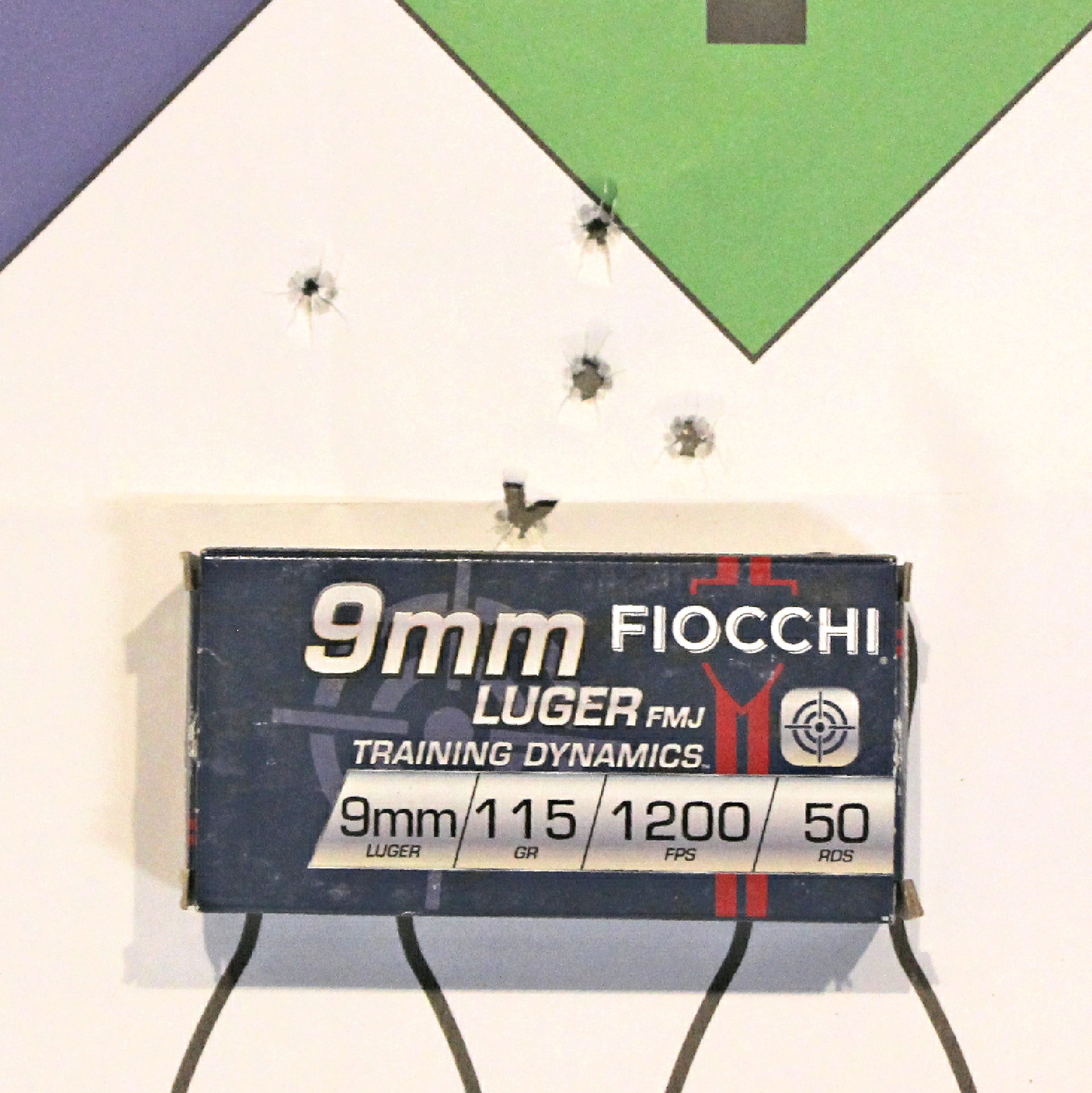 Fiocchi 9 mm ammunition box shown with target and accuracy holes grouping