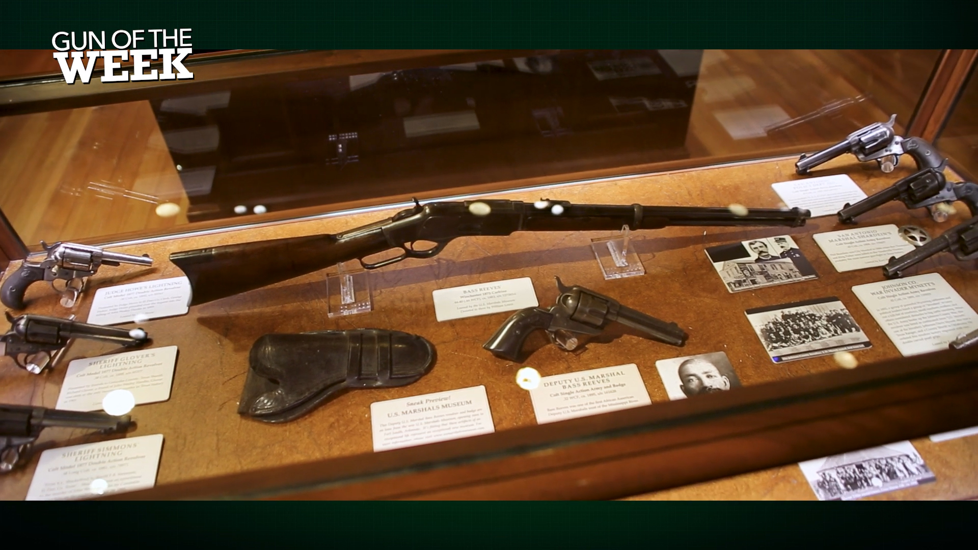 GUN OF THE WEEK text on image display case lever-action carbine single-action revolvers